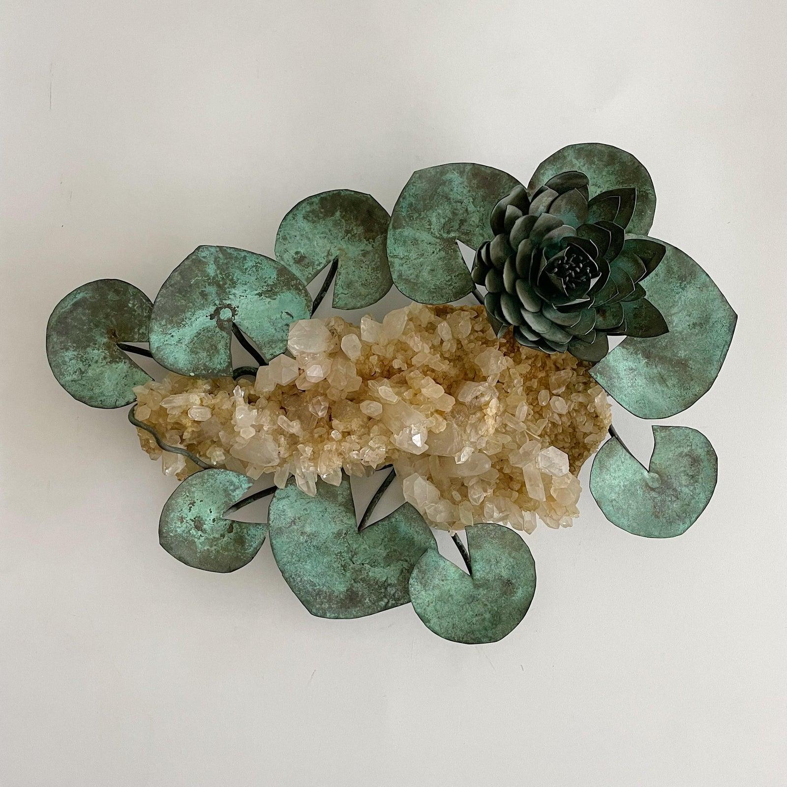 Exceptional tabletop sculpture with rock crystal in the center surrounded by a large copper lily and leaves, the copper showing years of deep patina. Unsigned.