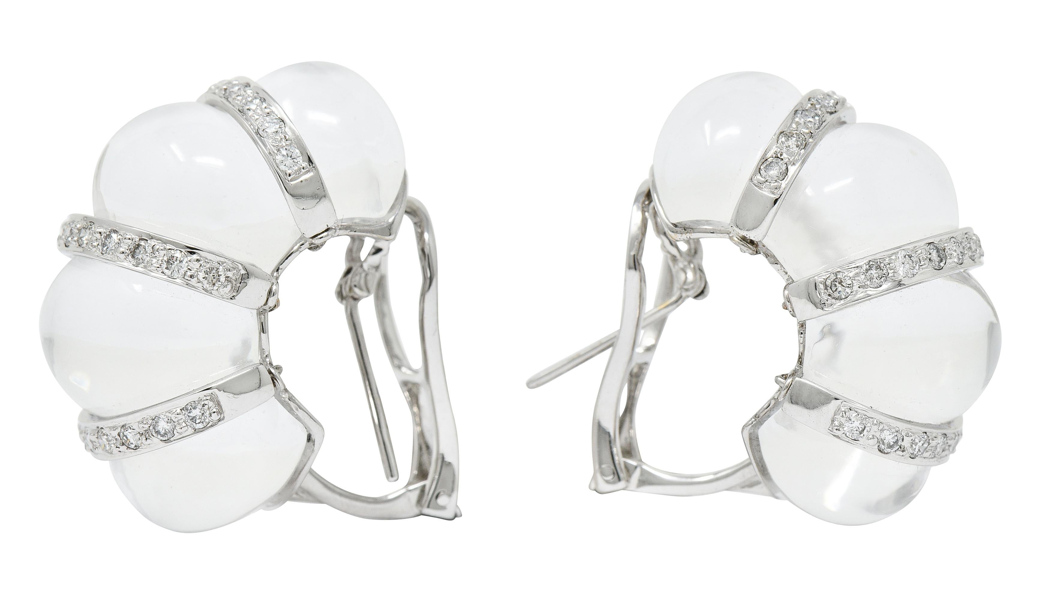 Substantial J hoop style earrings feature carved rock crystal quartz cabochons

With white gold bands, East to West, bead set with round brilliant cut diamonds

Weighing in total approximately 1.50 carats with G/H color and SI clarity

Completed by