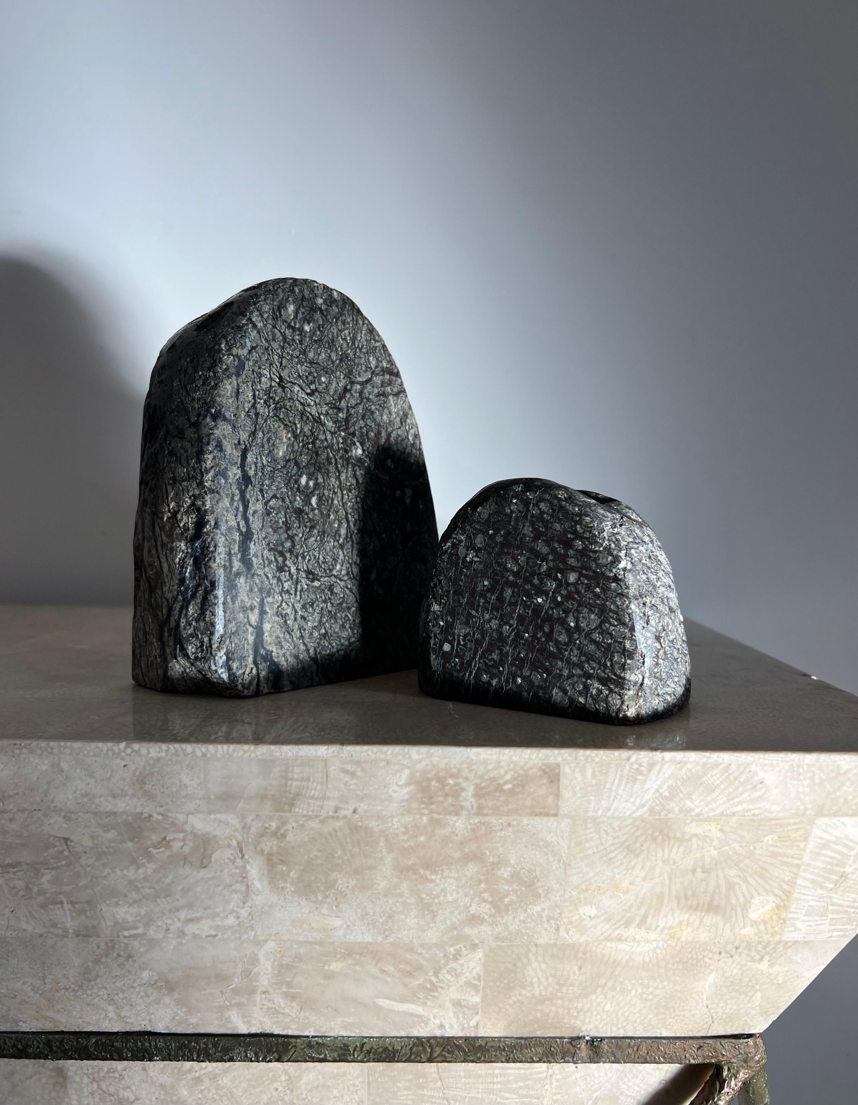 A pair of bouldercore candelaria, 1970s. Tones of basalt, moss, and aubergine. Real stone - heavy. Felted bases. Pick up in LA or worldwide delivery options available.
Big: 4.5” W x 2” D x 6” H
Small: 3.5” W x 2” D x 3” H