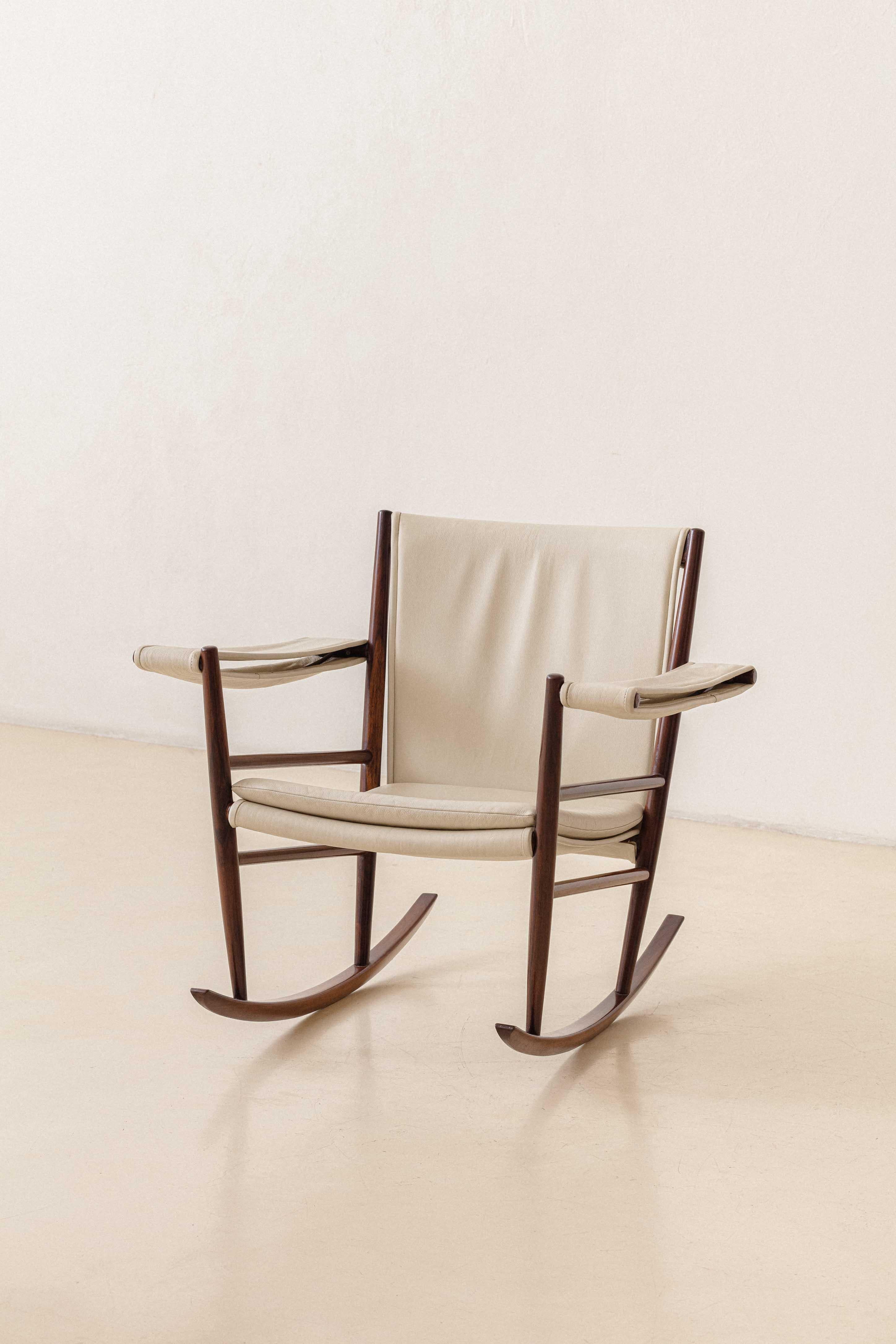 This rocking chair was one of the first pieces produced by Joaquim Tenreiro (1906-1992) when his Langenbach & Tenreiro store opened in 1947.

Far beyond a designer and artist, Tenreiro was an intellectual and thinker of the Brazilian