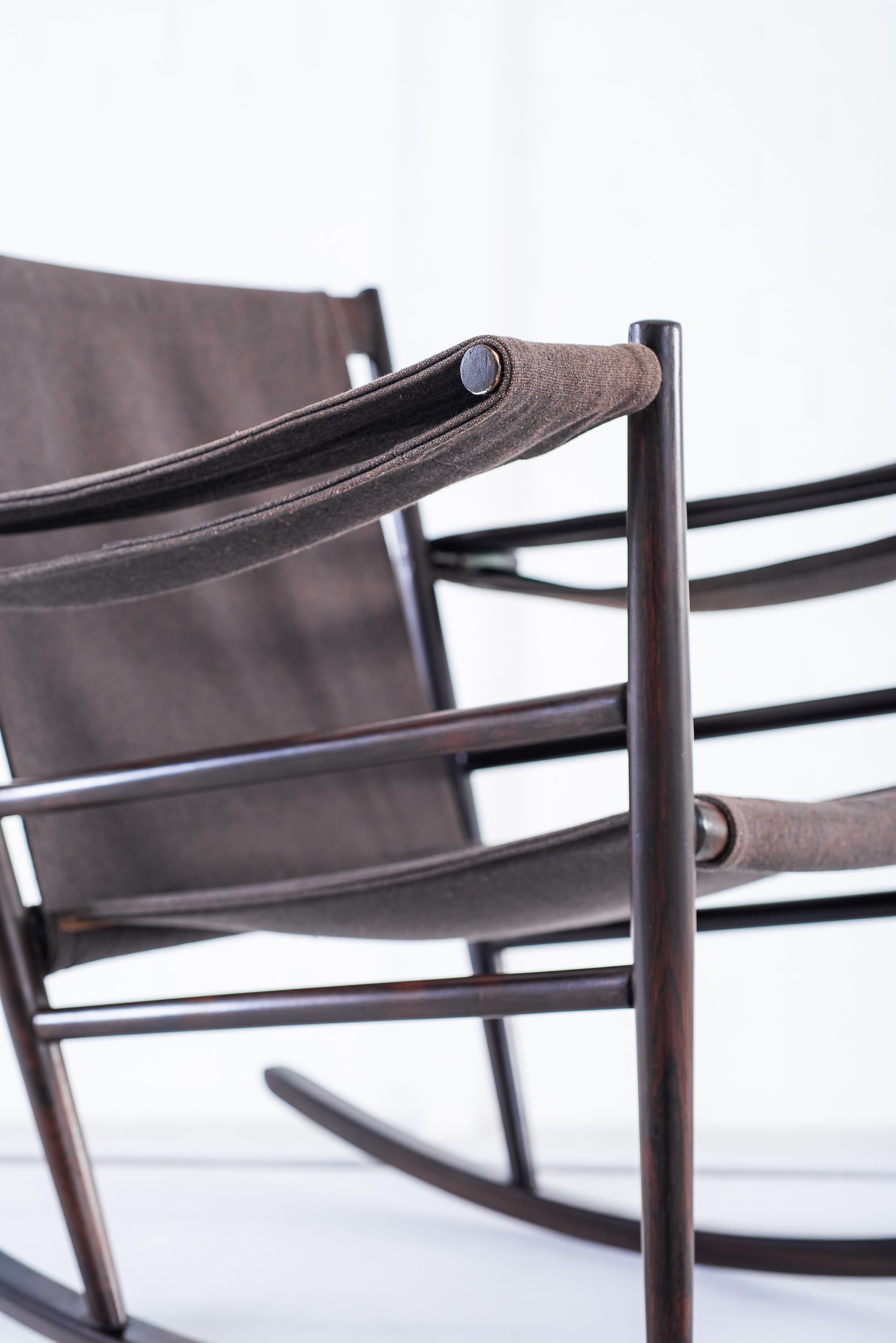 Tenreiro's rocking chair is one of his masterpieces. 
No doubt, it's an icon of Tenreiro's much-celebrated work.

This piece is in its original vintage condition.