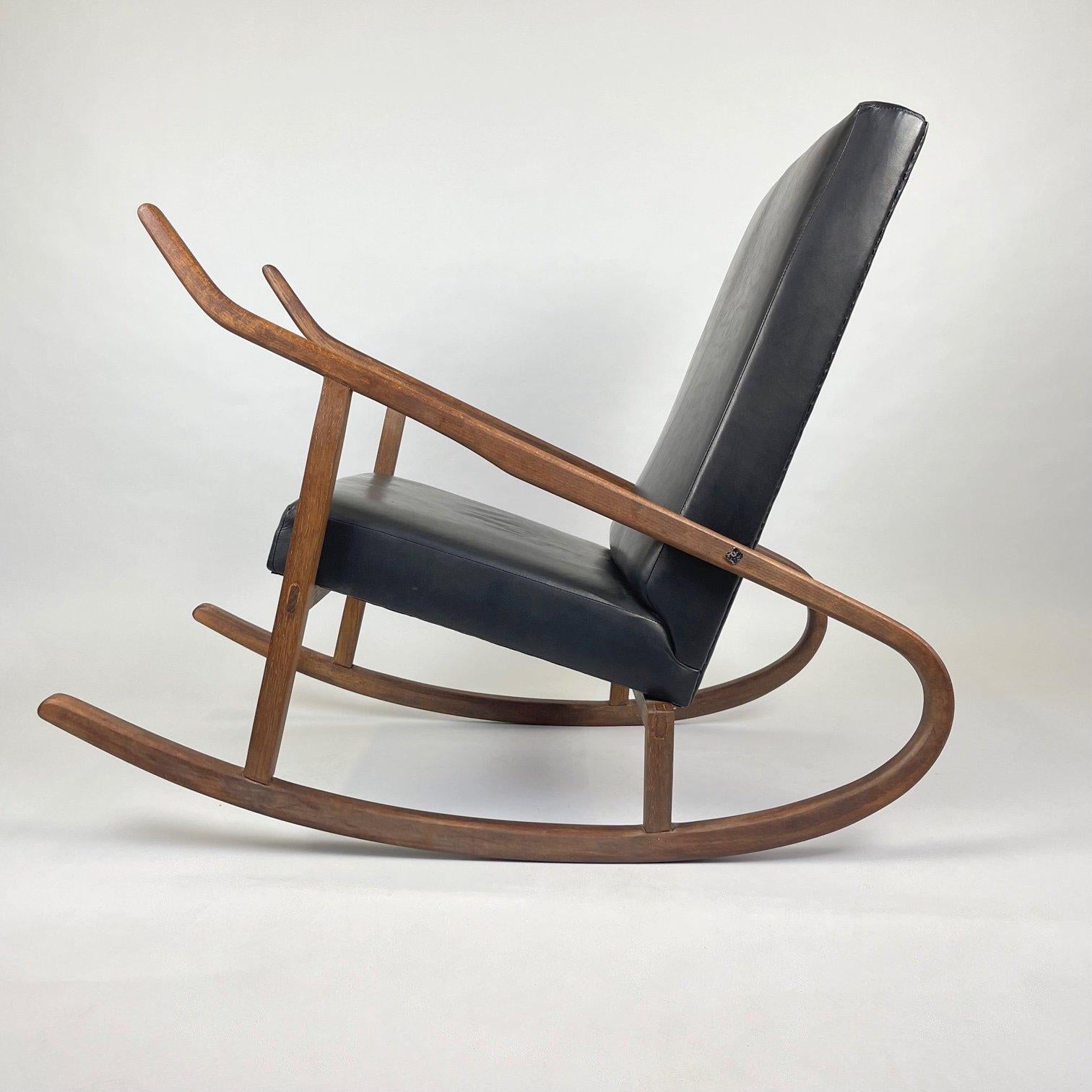 Comfortable, rarely seen, vintage rocking chair after complete renovation. 
The new upholstery is made of goatskin.