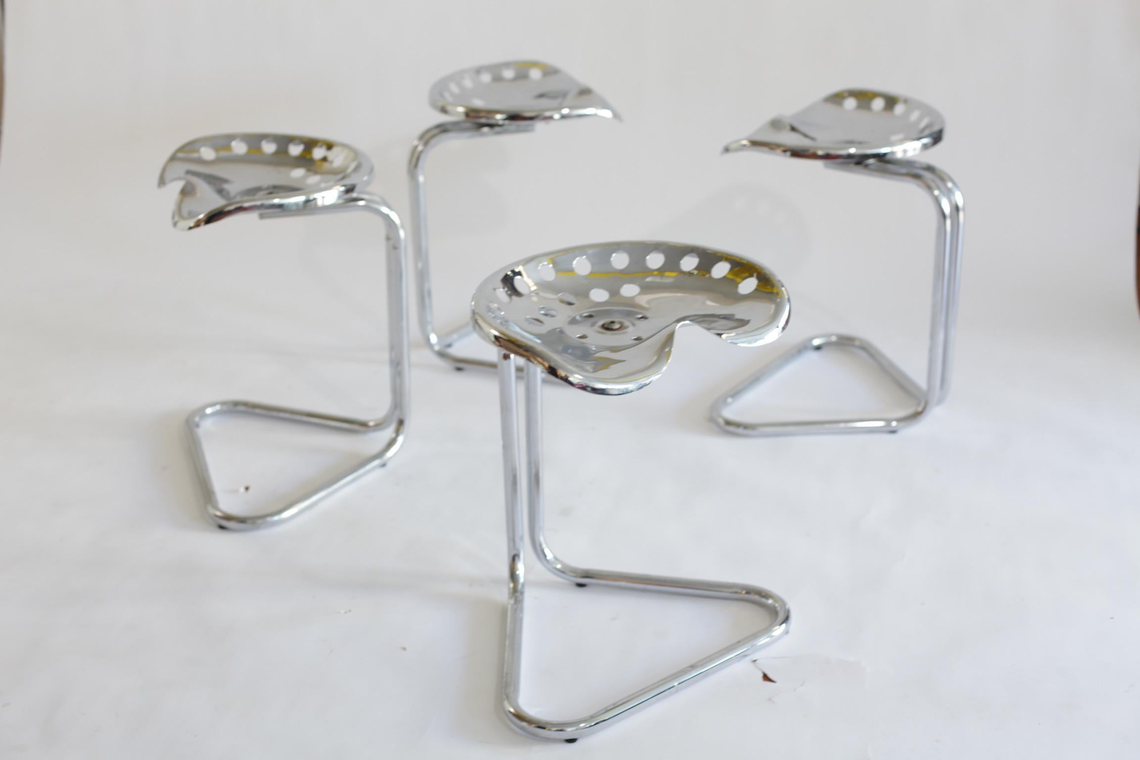 Vintage Rodney Kinsman Chrome T7 Tractor Stools, ca. 1960s. Sold as a pair of four. Affixed to a tubular cantilevered base. Seat base can be adjusted 180 degrees. 17 1/2 x 13 x 21 H.