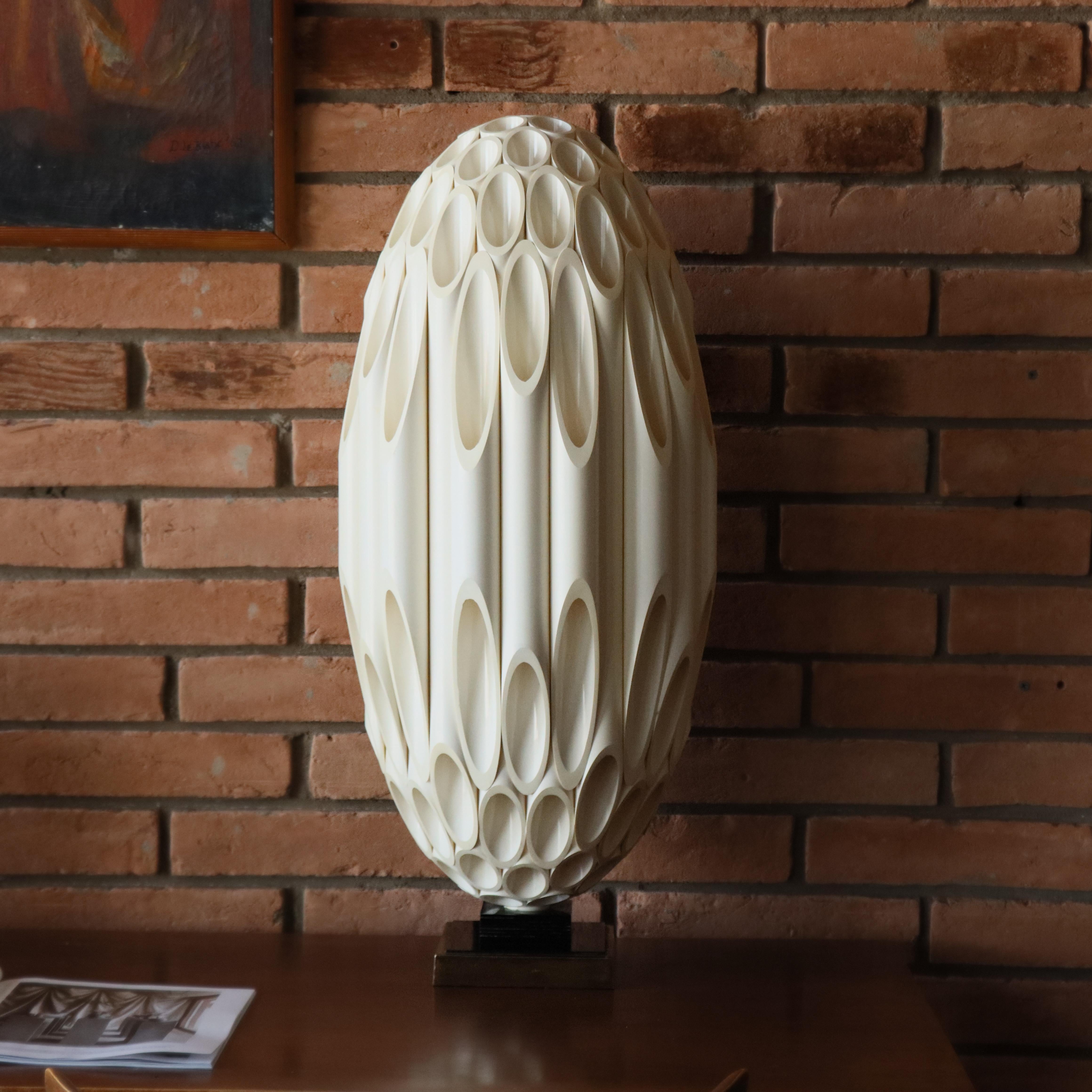 Vintage Roger Rougier for Maison Rougier Tube table lamp Canada, 1970s. 

Made from brass-plated metal and PVC plastic, Rougier ‘tube’ lamps were first made in the 1970s as props for Paramount Studios. 

This lamp has appeared in Star Trek, Scarface