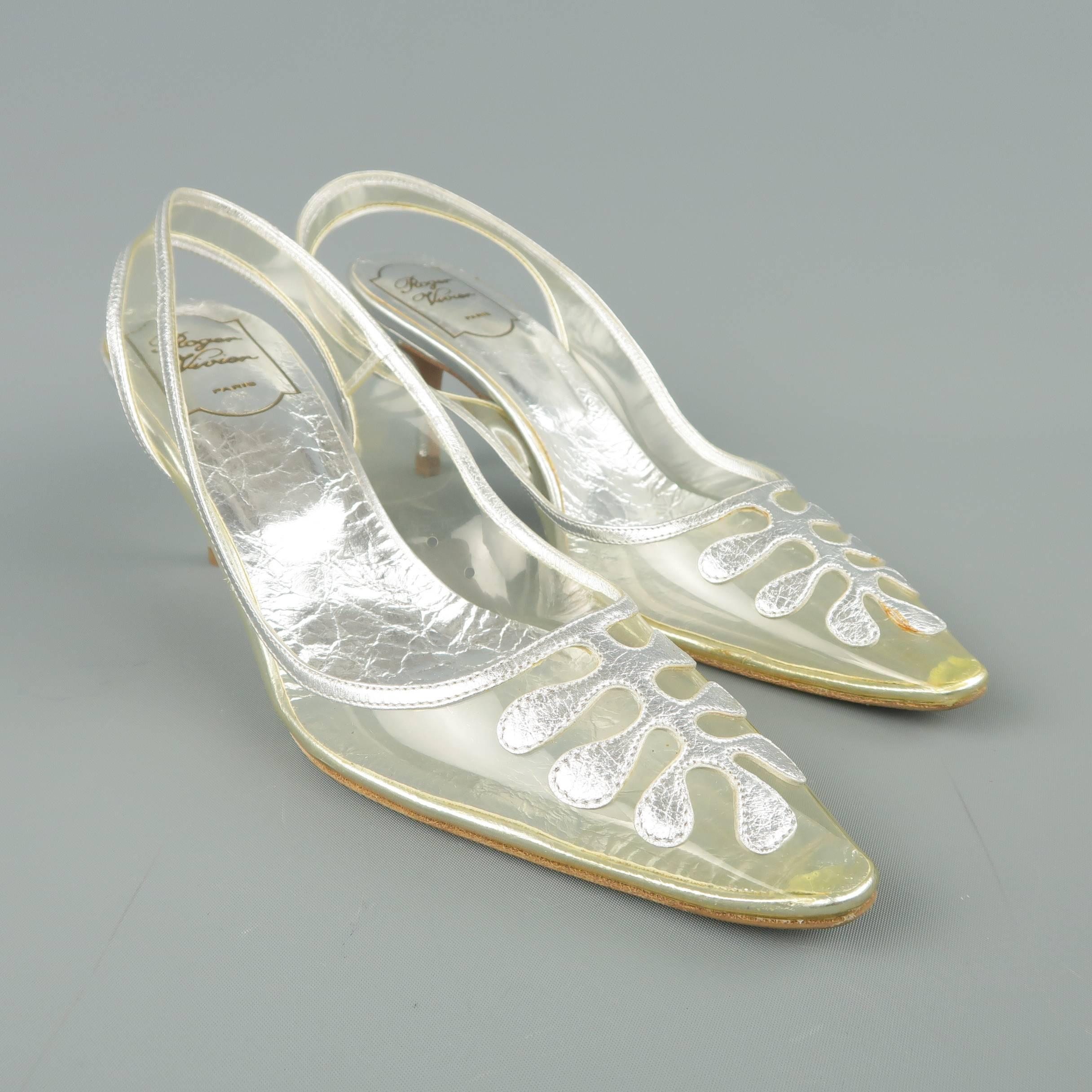 Vintage ROGER VIVIER pumps come in clear pvc with a pointed toe, metallic silver leather piping and design, and covered stiletto heel. Never worn. Minor aging to vinyl and discolorations. As-is. With dust bags. Made in Italy.
 
New With Defects. IT
