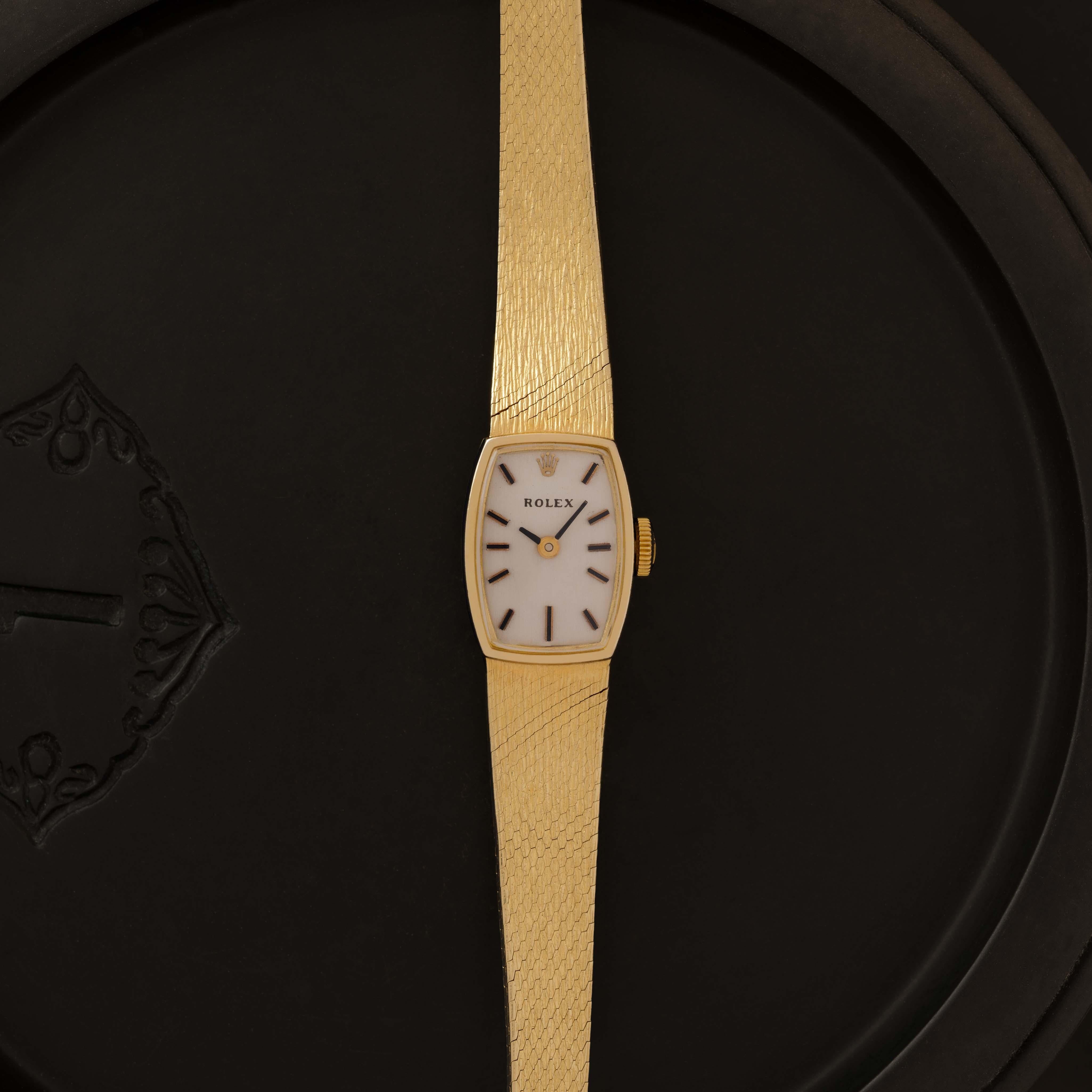 Maker: Rolex
Model: 8131
Material: 14k Yellow Gold
Dial: Silver/Cream
Case Measurement: --mm
Movement: Manual Wind
Condition: Vintage
Weight: 22 Grams
Size: Adjustable, Fits Up to 7.0