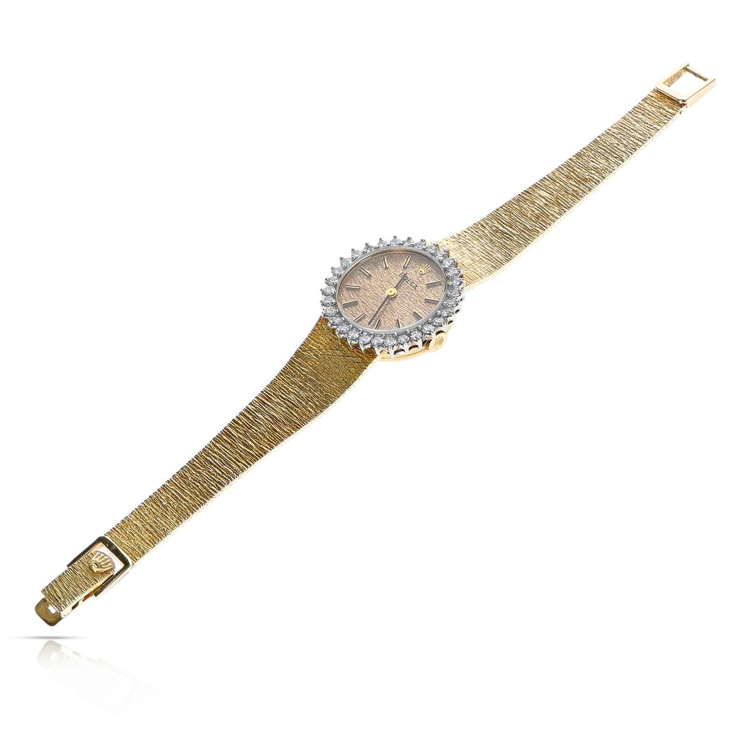 A Vintage Rolex 14K Yellow Gold Diamond Bezel Watch. Length: 6.50