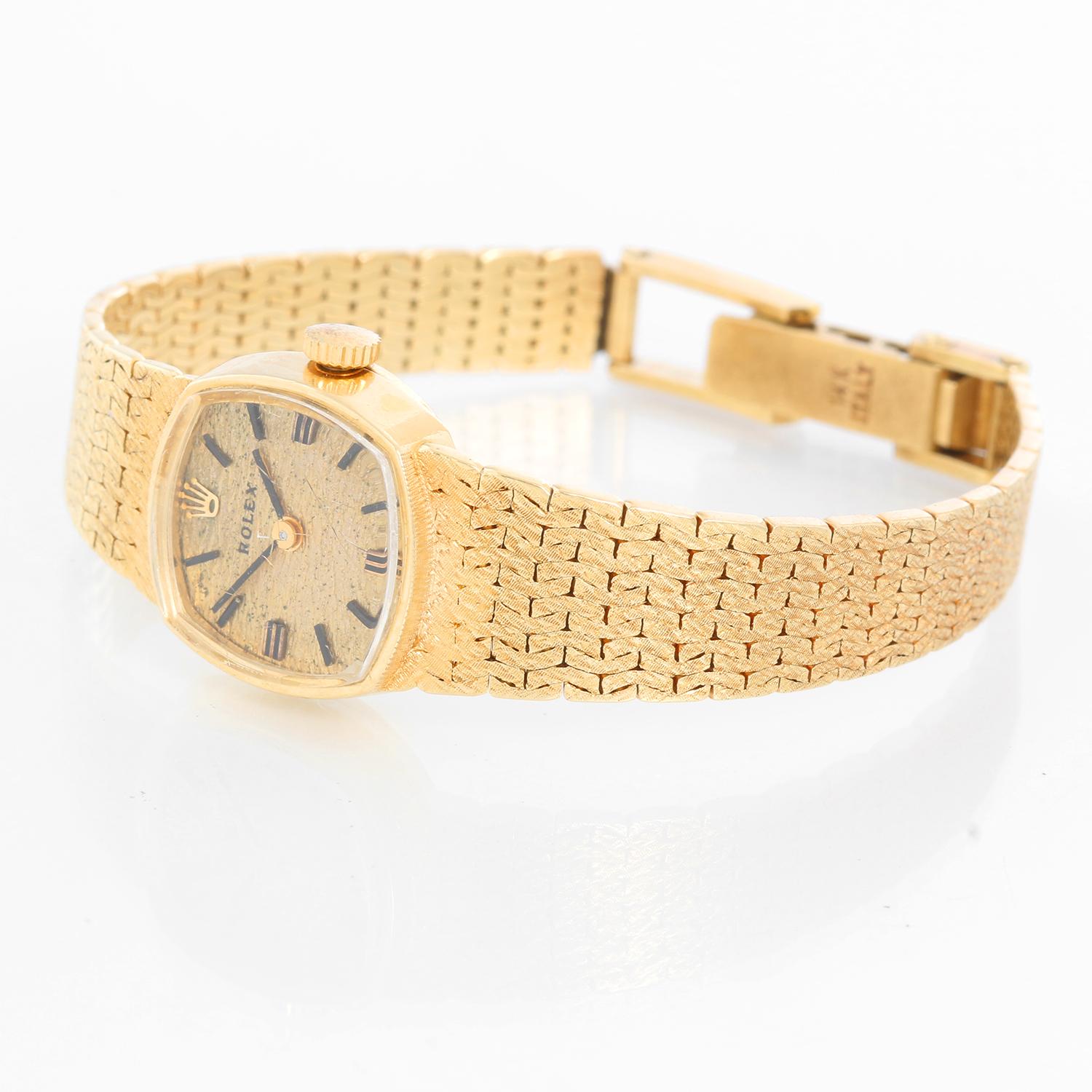 Vintage Rolex 14K Yellow Gold Rolex Watch Ref. 8214  - Manual. 14K Yellow gold case ( 17 mm ). Champagne textured dial with stick hour markers. 14K yellow gold mesh bracelet; will fit up to a 5 inch wrist. Pre-owned with custom box. Circa 1960's.