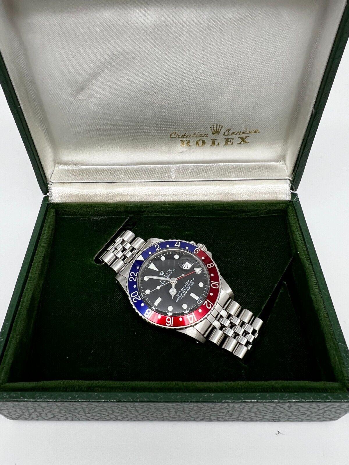 Style Number: 1675

Serial: 1318***

Year: 1966
 
Model: GMT Master
 
Case Material: Stainless Steel
 
Band: Stainless Steel
 
Bezel: Pepsi - Red and Blue 
 
Dial: Black
 
Face: Acrylic 
 
Case Size: 40mm 
 
Includes: 
-Rolex Watch Box
-Certified