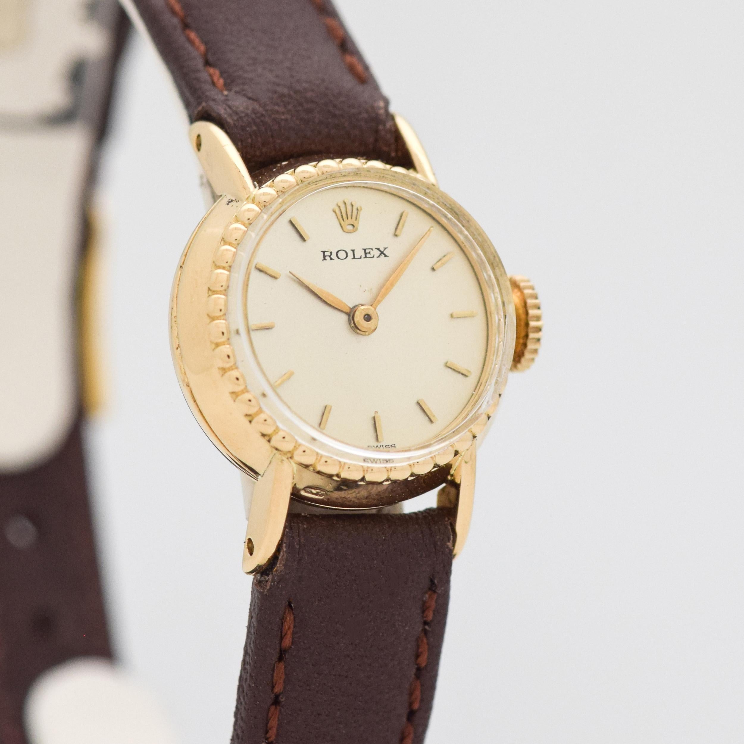 1960's - 1970's Vintage Rolex Ladies Ref. 9111 18K Yellow Gold watch with Silver Dial with Applied Gold Stick/Bar/Baton Markers. Case size, 18mm x 22mm lug to lug (0.71 in. x 0.87 in.) - Powered by a 17-jewel, manual caliber movement. Triple Signed.