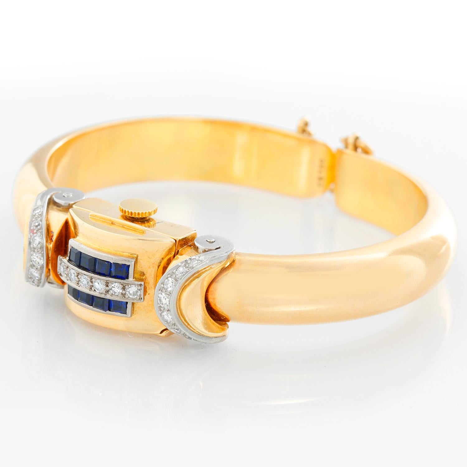 Vintage Rolex 18K Yellow Gold Ladies Watch - Manual winding. 18K Yellow gold case (13 x 28 mm ) with diamonds and sapphires. Silvered dial with yellow gold hour markers. 18K Yellow gold mango style bracelet; bracelet will fit a 6 inches . Pre-owned
