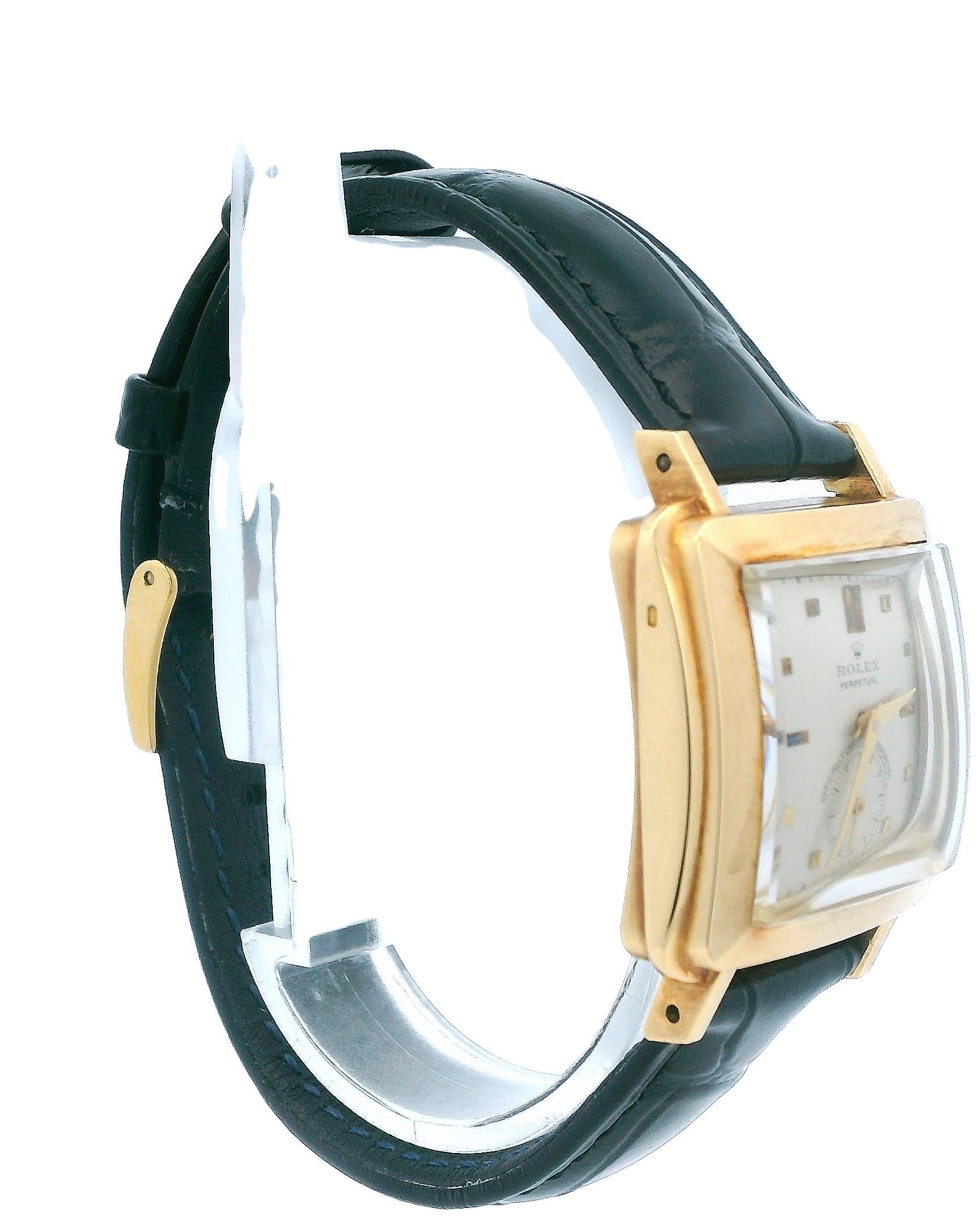 Rolex Perpetual 4643 Vintage Watch: This watch features an 18K yellow gold case with a size of 28.2mm and an original ivory dial with gold hands and hour markers. It comes with an aftermarket leather strap and an 18K yellow gold Rolex tan buckle. A
