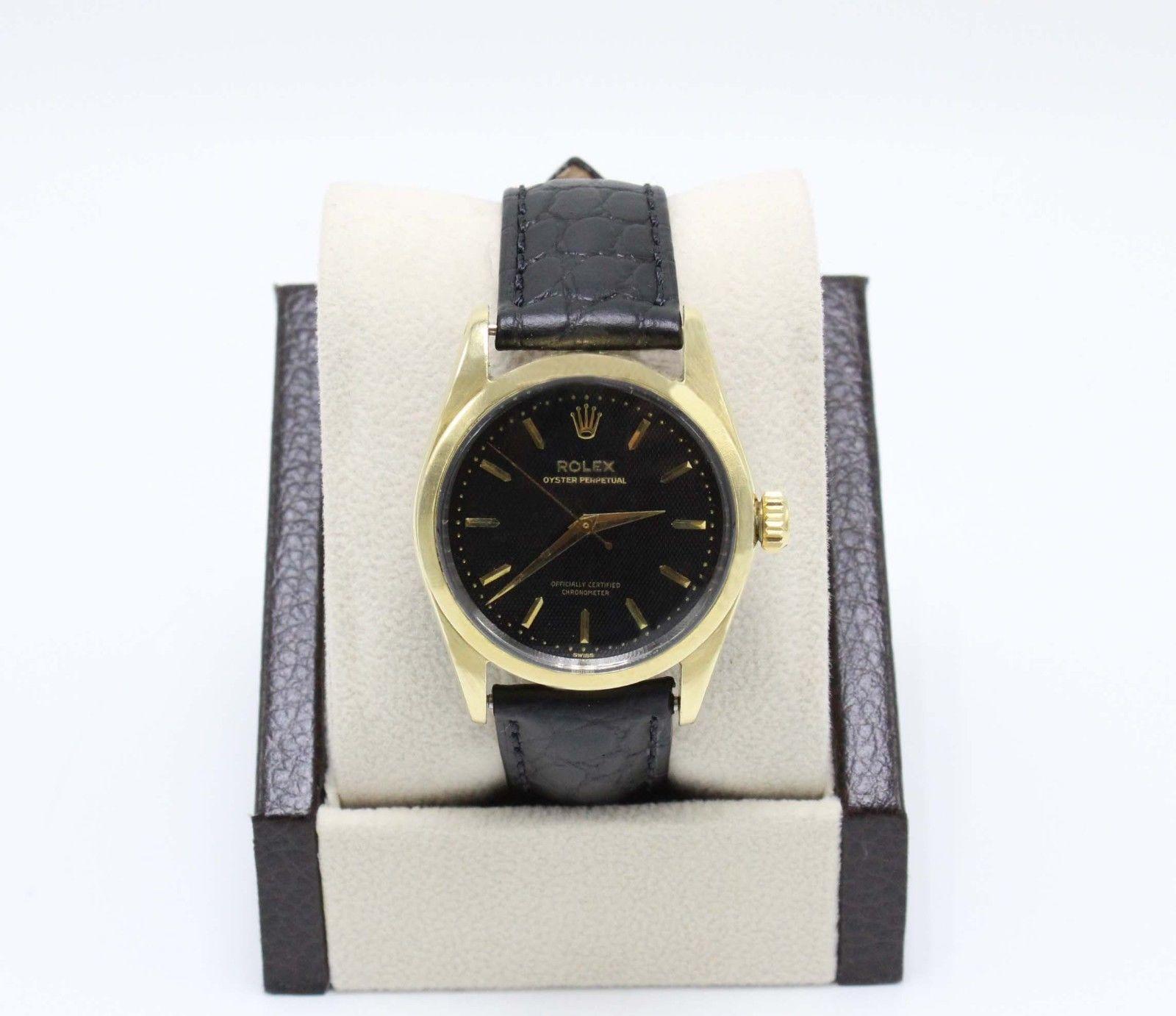 Style Number: 6634

Serial: 242***   1942

Model: Oyster Perpetual

Case Material: 14K Yellow Gold over Stainless Steel

Band: Black Leather

Bezel: 14K Yellow Gold over Stainless Steel 

Dial: Black

Face: Acrylic

Case Size: 34mm

Includes: