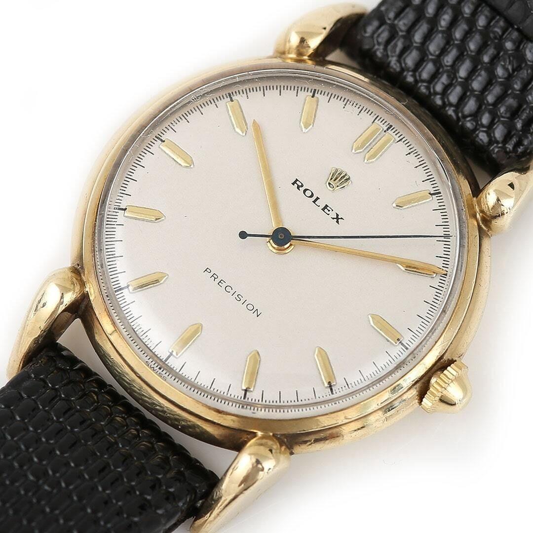 A wonderful vintage 9ct gold Rolex manual dress watch dating from the 1950s. A wonderful piece of Rolex history this Rolex Precision has lots of timeless style including the rare shaped fancy 'teardrop lugs'. We are all very aware that collectors