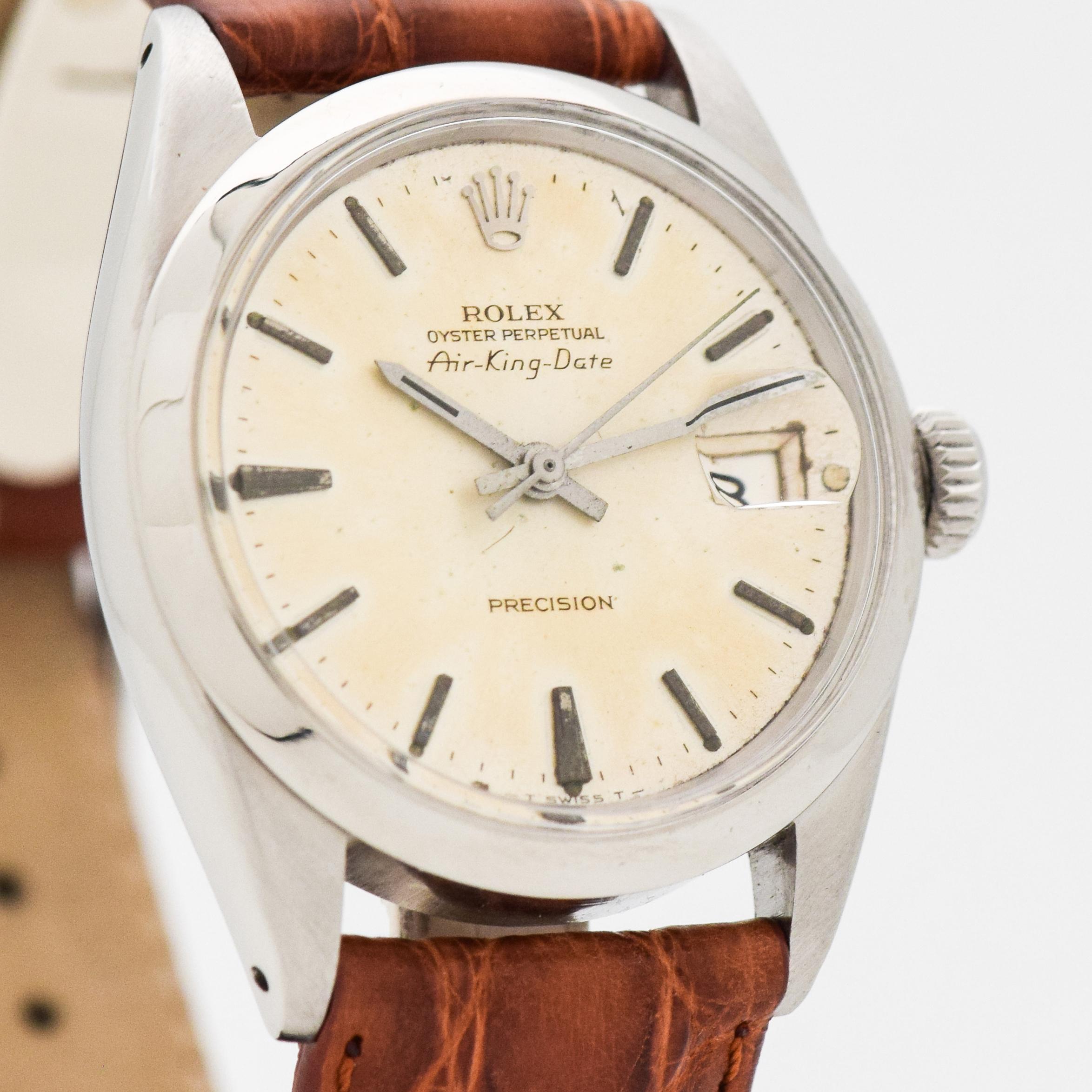 1968 Vintage Rolex Air-King Date Ref. 5700 Stainless Steel watch with Original Silver Dial with Applied Steel Stick/Bar/Baton Markers. 34mm x 40mm lug to lug (1.34 in. x 1.57 in.) - 26 jewel, automatic caliber movement. Triple Signed.