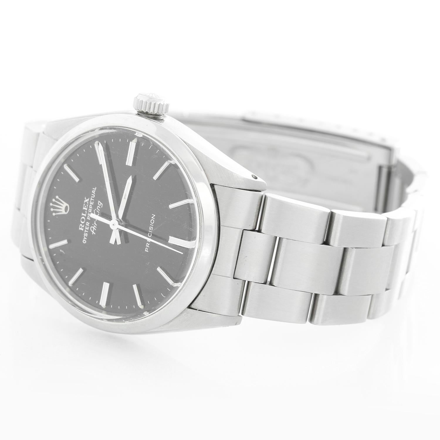 Vintage Rolex Air-King Men's Stainless Steel Oyster Perpetual Watch 5500 - Automatic winding, acrylic crystal. Stainless steel case with smooth bezel (34mm diameter). Black dial with stick hour markers. Stainless steel Oyster bracelet. Pre-owned