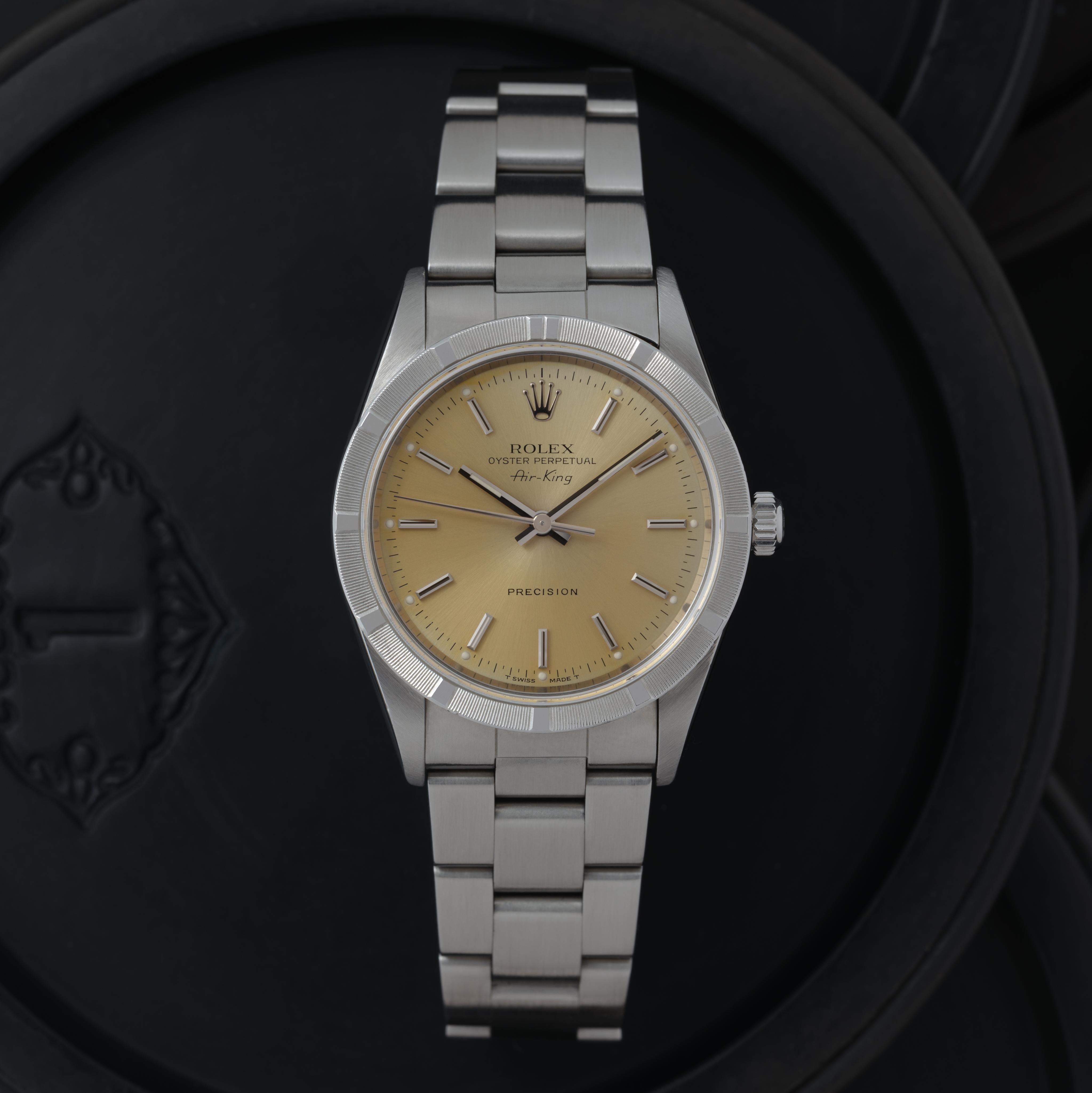 Vintage Rolex Air King Model 14010 Stainless Steel, 34mm Champagne Dial, Automatic Movement, Made in Switzerland c.1999

Maker: Rolex
Model: Air King 14010
Year: 1999
Material: Stainless Steel
Dial: Champagne Dial
Case Measurement:  34mm
Movement: