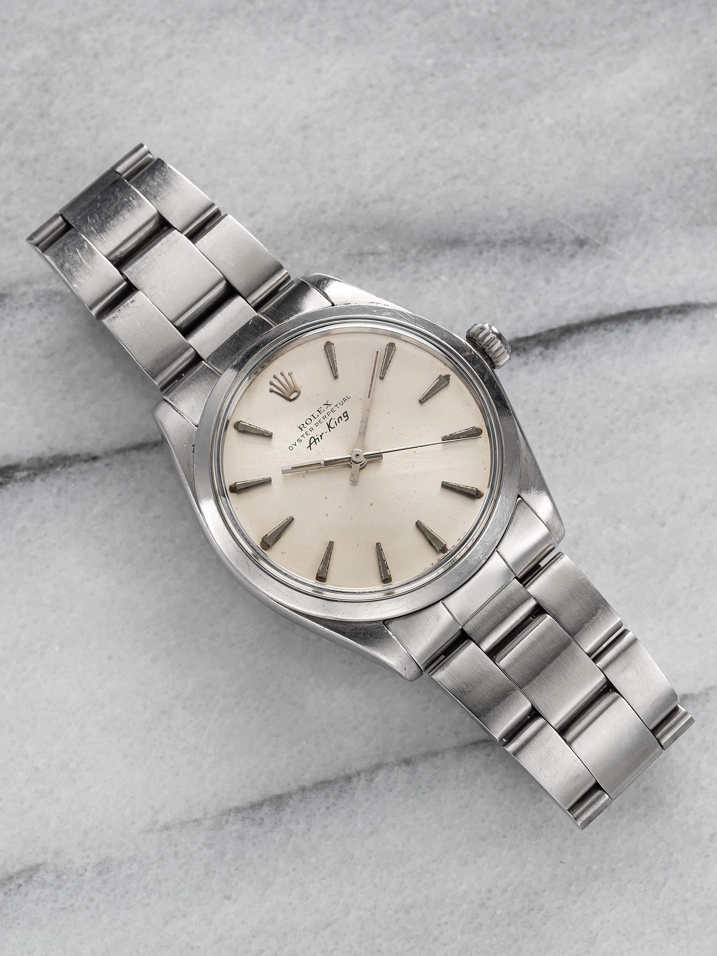 Here's a vintage Rolex Air King precision reference 5500 automatic with a silver dial from the 70s. Keeps great time and is fully functional. Measurements include a 34mm oyster case and 19mm lug width. It's on its original heavy oyster bracelet that