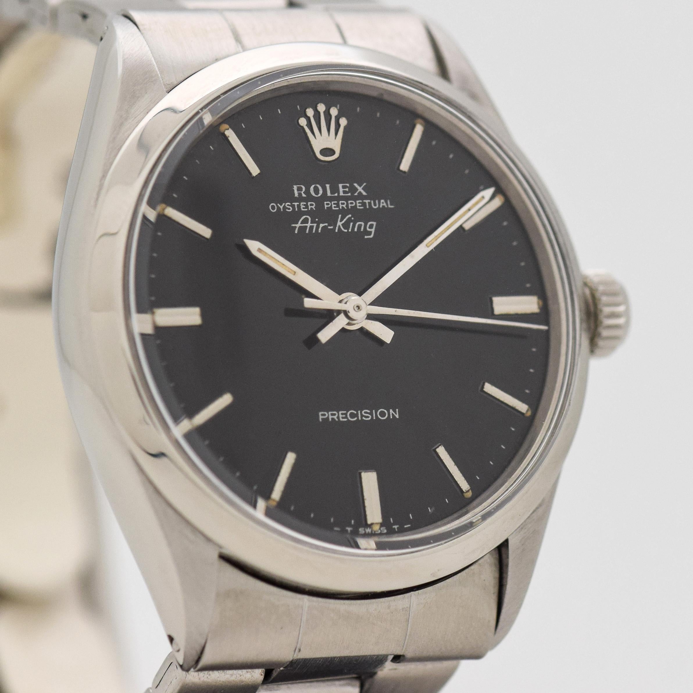1970 Vintage Air-King Ref. 5500 Stainless Steel watch with Black Dial with Applied Steel Stick/Bar/Baton Markers with Original Rolex Stainless Steel Oyster Bracelet.  Triple Signed.  Fits up to a 6 1/4 Inch Wrist, Suited for a Smaller Wrist. A Watch