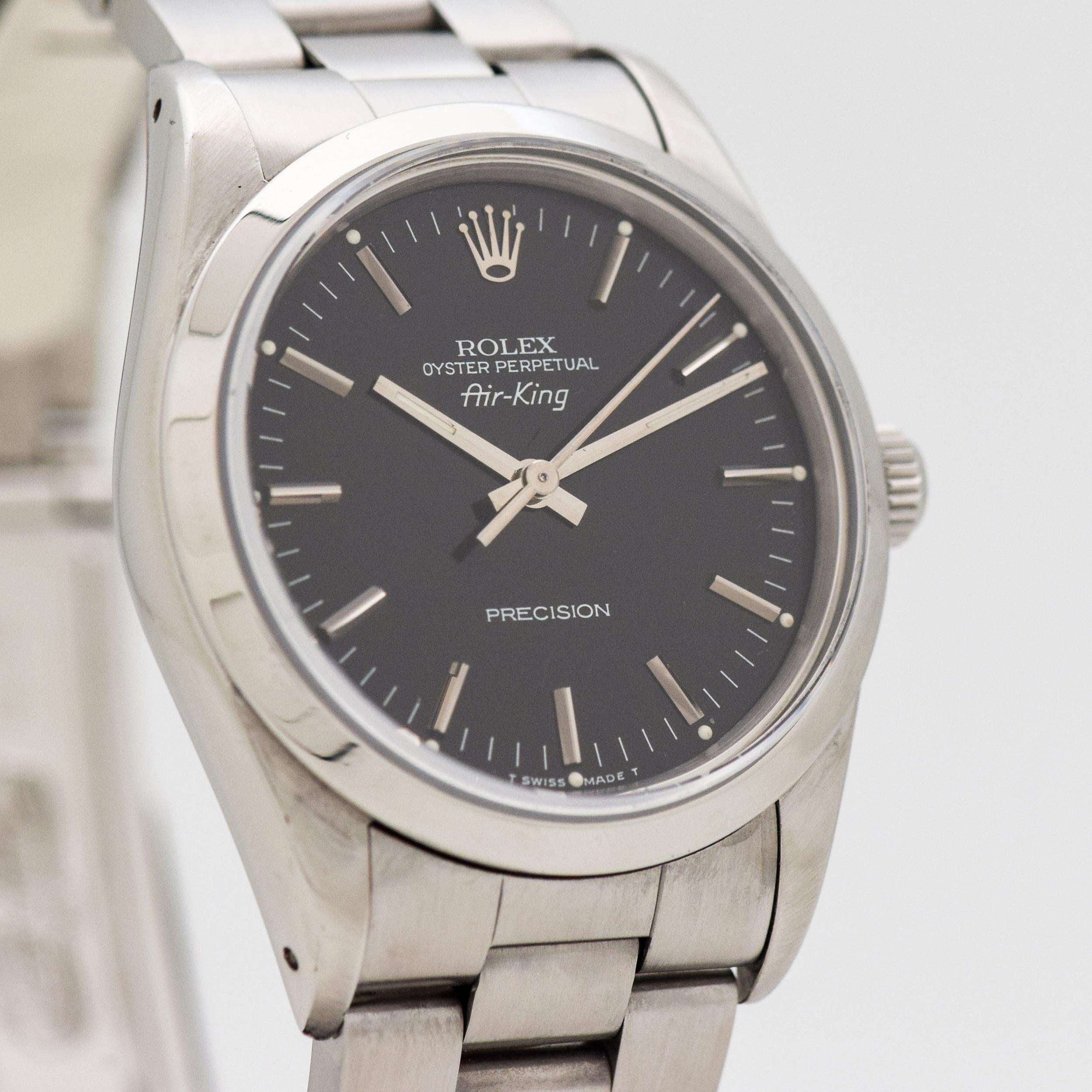 1989 Rolex Air-King Ref. 14000 Stainless Steel watch with Original RARE Charcoal Black Dial with Applied Steel Stick/Bar/Baton Markers with Original Rolex Stainless Steel Oyster Bracelet. 34mm x 43mm lug to lug (1.34 in. x 1.69 in.) - Powered by a