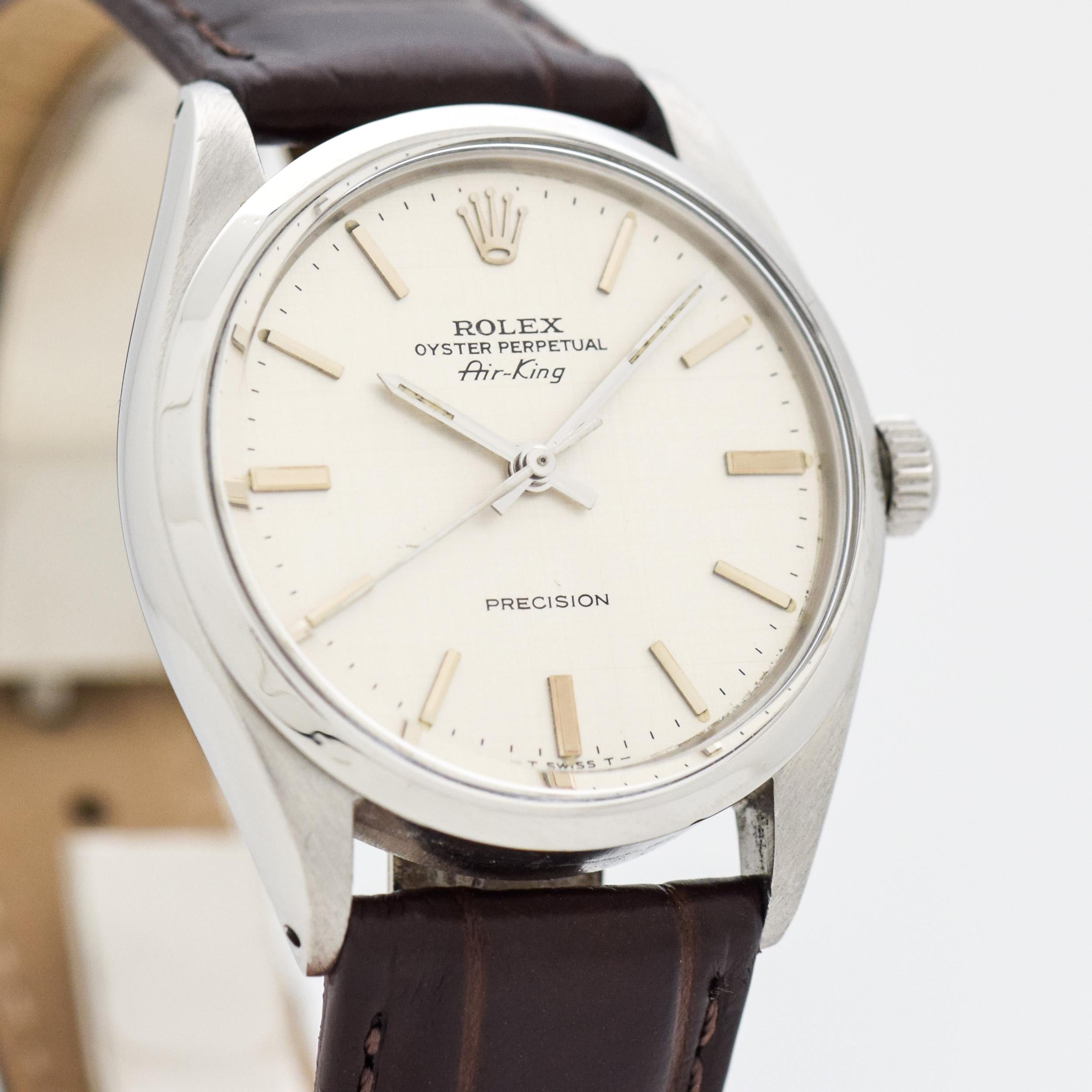 1966 Vintage Rolex Air-King Ref. 5500 Stainless Steel watch with Rare Original Linen Textured Silver Dial with Applied Steel Beveled Stick/Bar/Baton Markers. 34mm x 38mm lug to lug (1.34 in. x 1.5 in.). 26 jewel, automatic caliber 1530 movement.