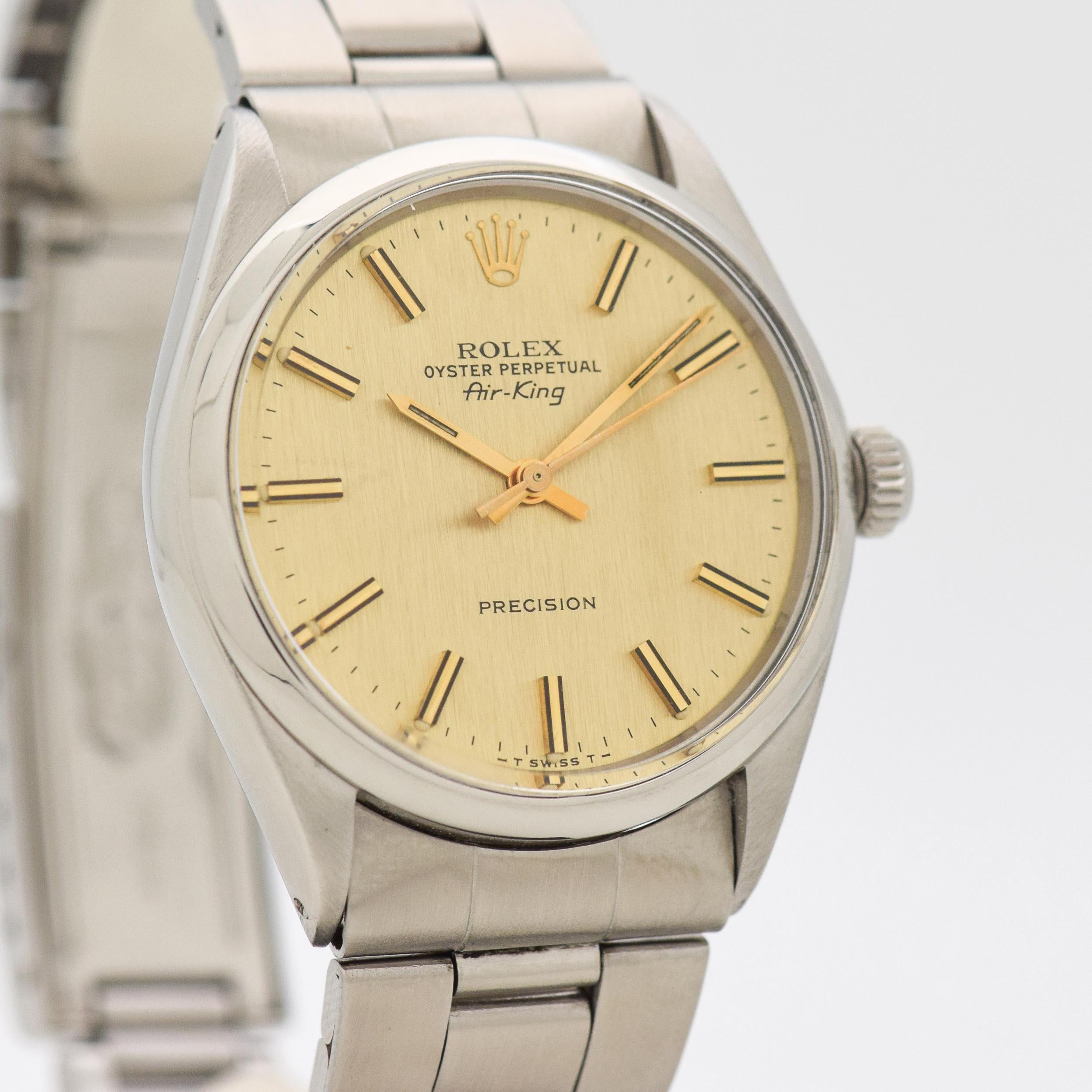 1972 Vintage Rolex Air-King Ref. 5500 Stainless Steel watch with Original RARE Unique Champagne Mildly Linen Textured Dial with Applied Gold Color Ridged Stick/Bar/Baton Markers with Original Rolex Stainless Steel Oyster Bracelet. Case size, 34mm x