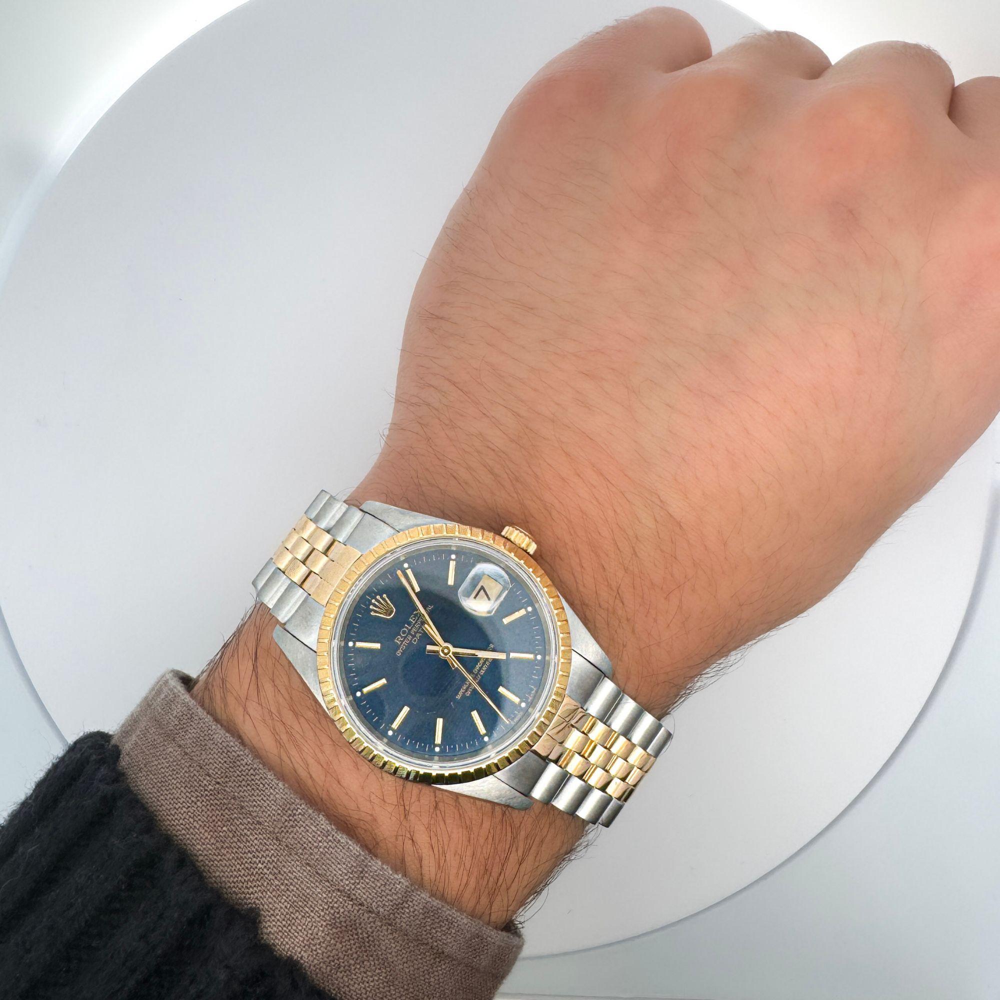 Vintage Rolex Oyster Date two-tone 18K yellow gold and stainless steel, with a fluted bezel on jubilee bracelet. Fully linked.

Details:
Item Type: Unisex Watch
Metal: Stainless Steel and 18K Yellow Gold
Size: 34mm case width
Year: 1990
Serial No.: