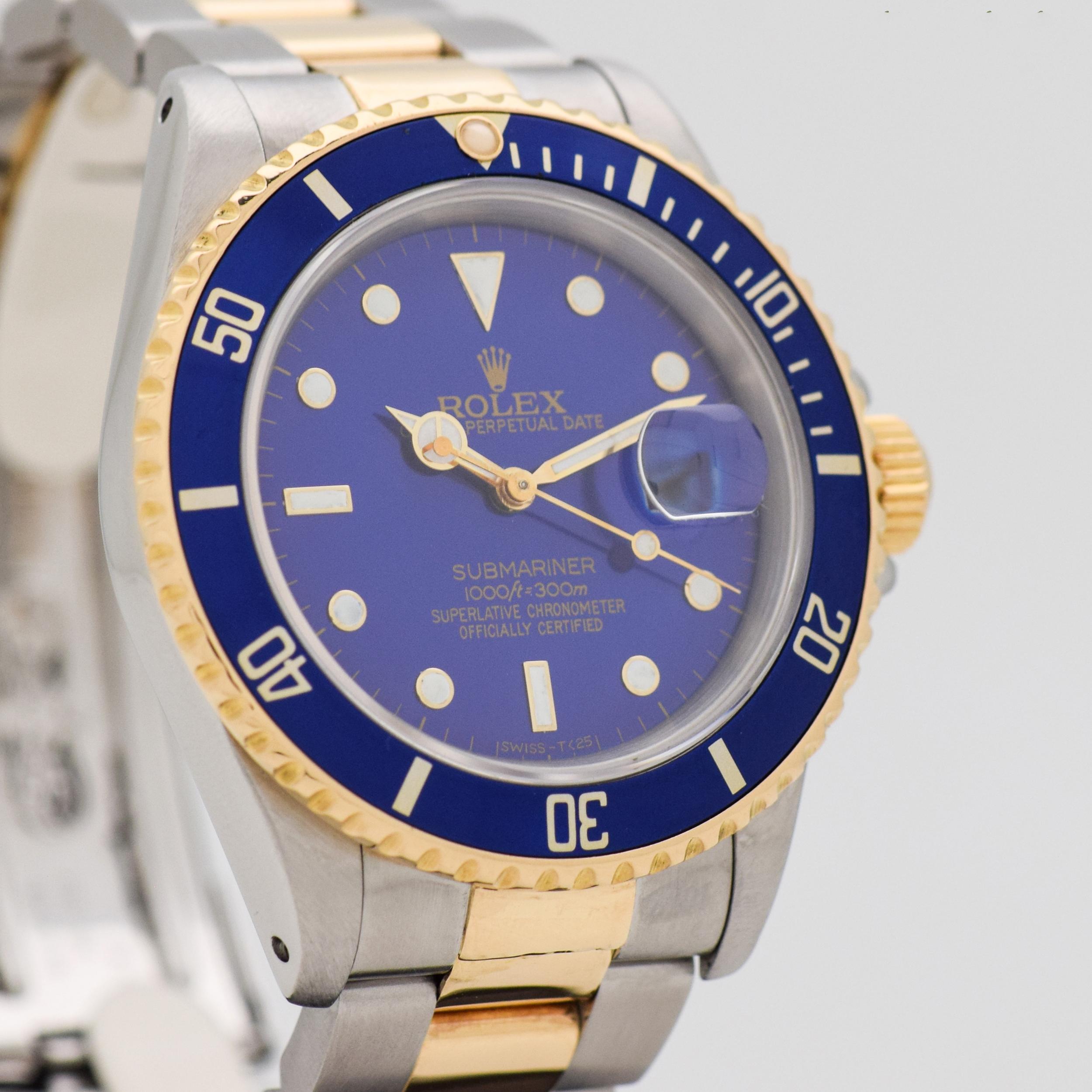1989 Vintage Rolex Blue Submariner Ref. 16613 Two Tone 18k Yellow Gold and Stainless Steel watch with Blue Dial with White Gold Framed White Luminous Dot, Bar. and Triangle Markers with Original Rolex Two Tone 14k Yellow Gold and Stainless Steel