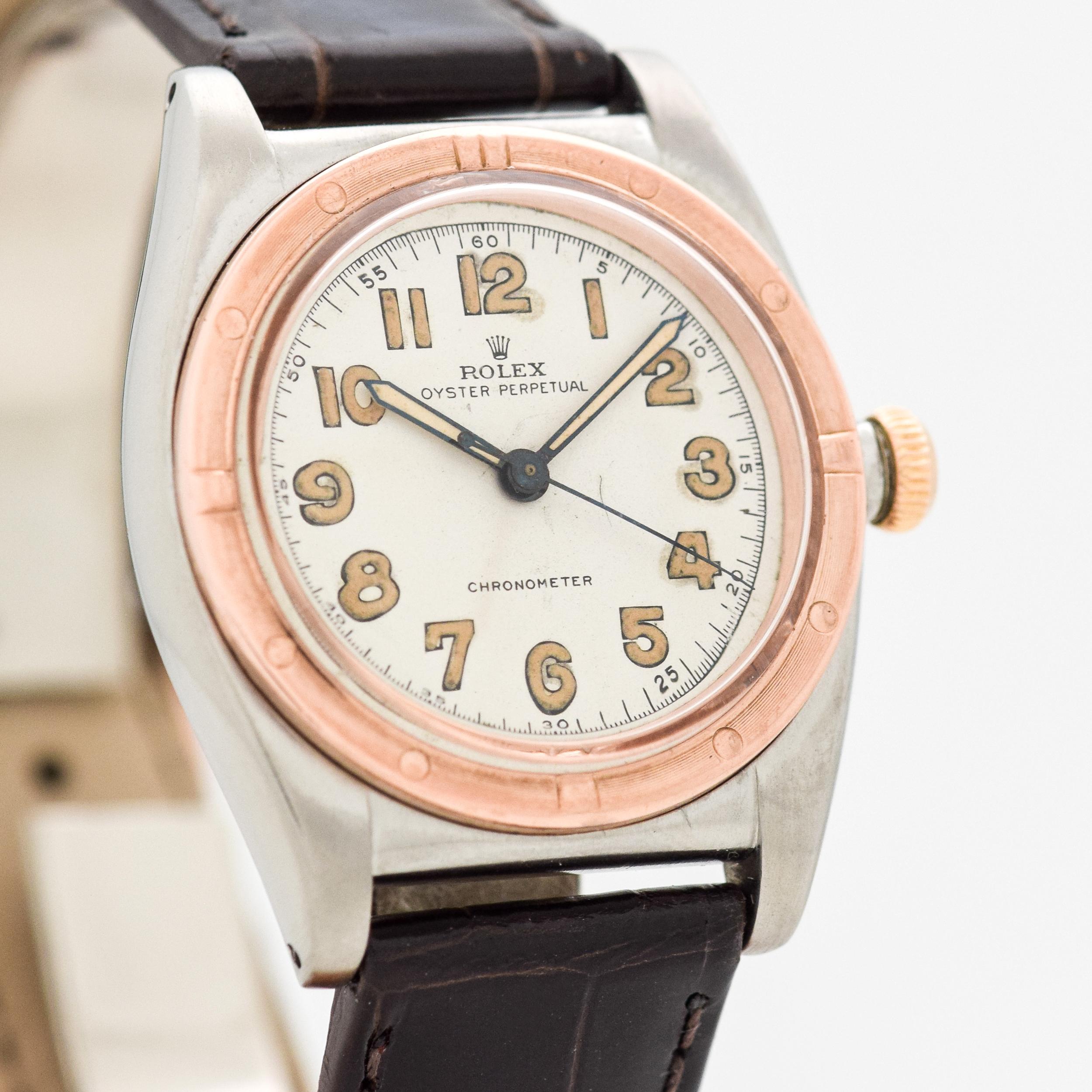 1944 Vintage Rolex Bubbleback Chronometer Ref. 3372 RARE Immediate Post WWII Two Tone 10k Rose Gold Machined Bezel with Stainless Steel Case watch with White Dial with Light Brown Luminous Arabic Numbers. 32mm x 38mm lug to lug (1.26 in. x 1.5 in.)