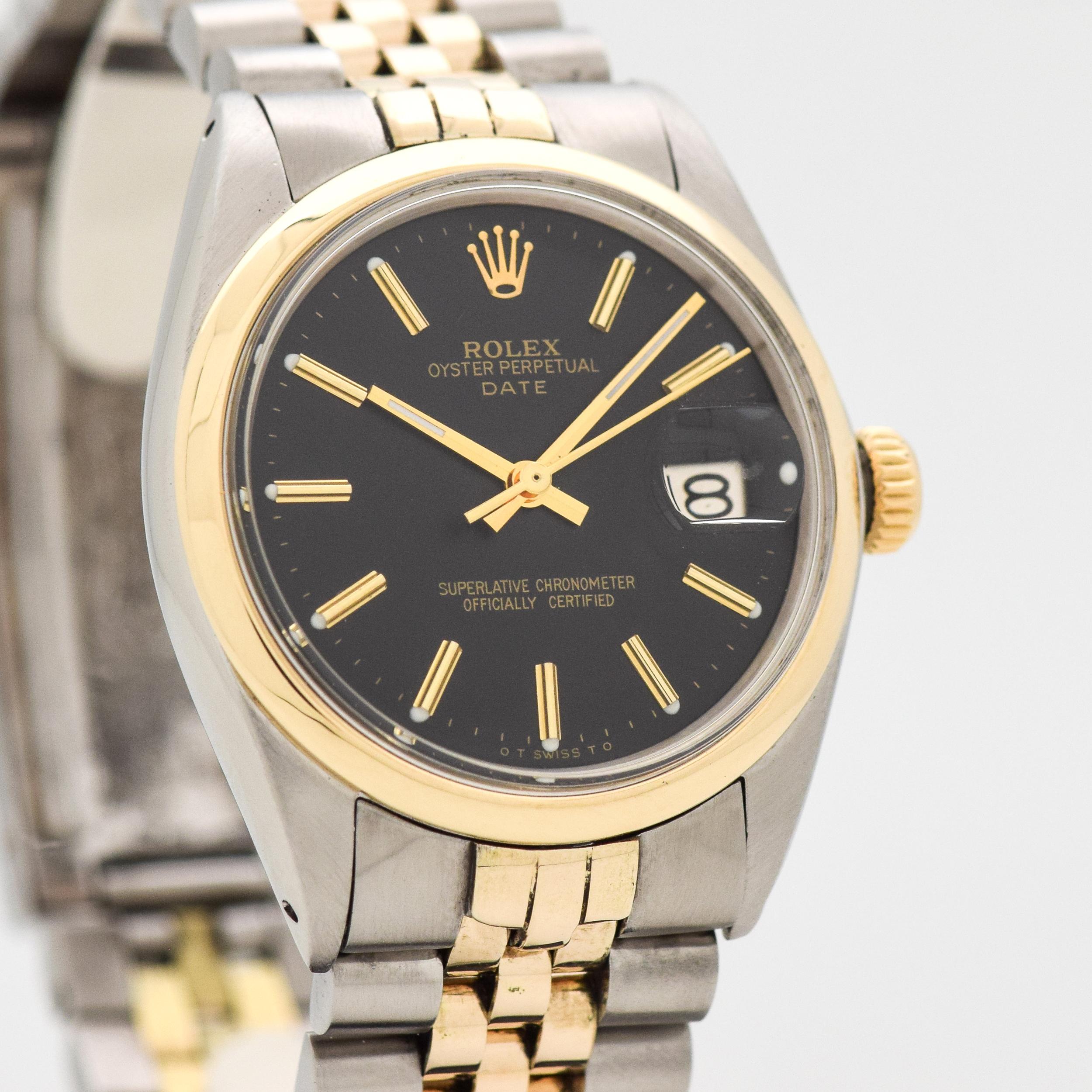 1969 Vintage Rolex Date Automatic Ref. 1500 Two Tone 14k Yellow Gold and Stainless Steel watch with Original Black Dial with Yellow Gold Beveled Stick/Bar/Baton Markers with Newer Rolex Two Tone 'D'Link 14k yellow Gold and Stainless Steel Jubilee