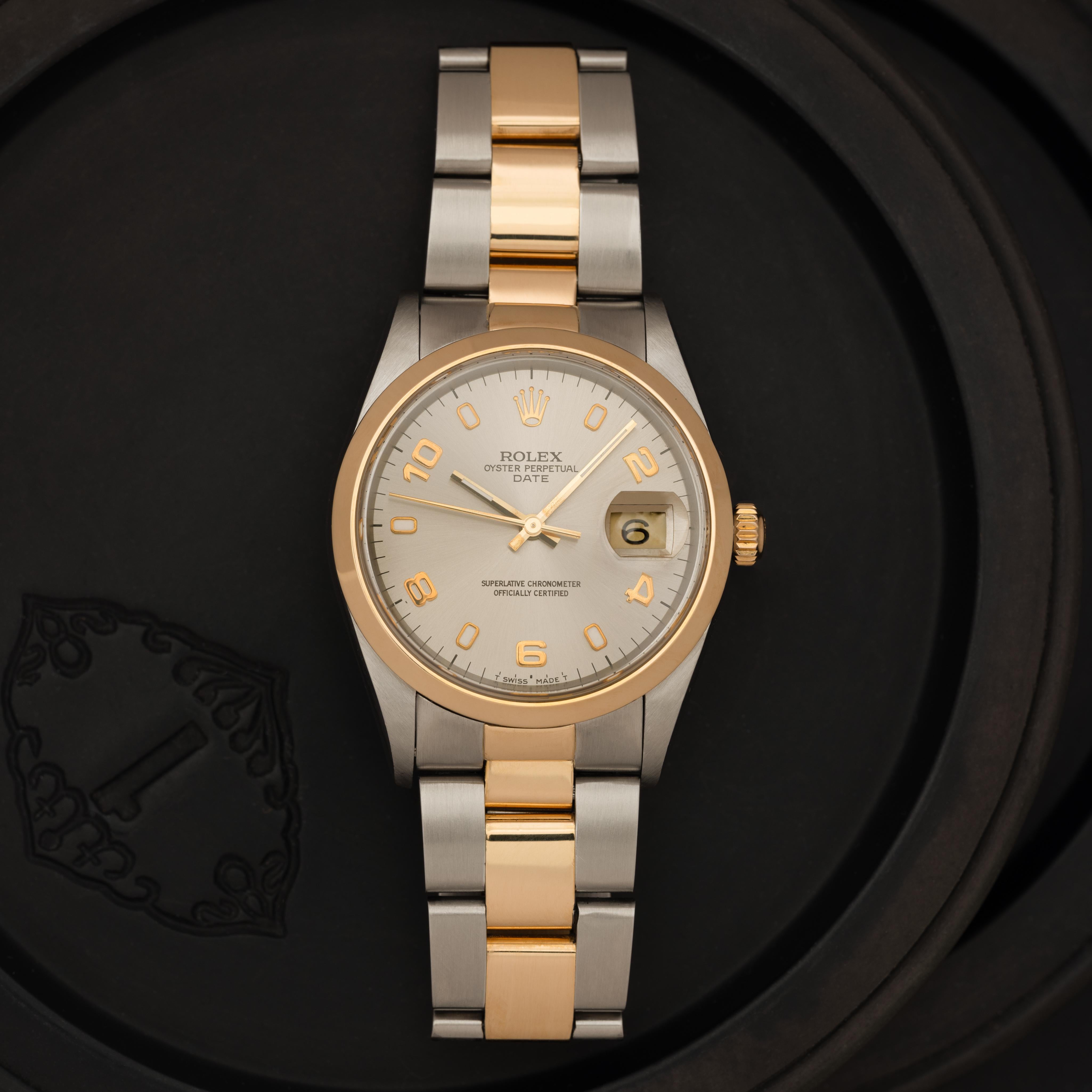 Rolex Date Model 15203 Stainless Steel and 18K Yellow Gold and 34mm Silver Arabic Dial 
c 1998

Maker: Rolex
Model: Date 15203
Year: 1998
Material: 18K Yellow Gold and Stainless Steel
Dial: 34mm Original Rolex Silver Arabic Dial
Case Measurement: