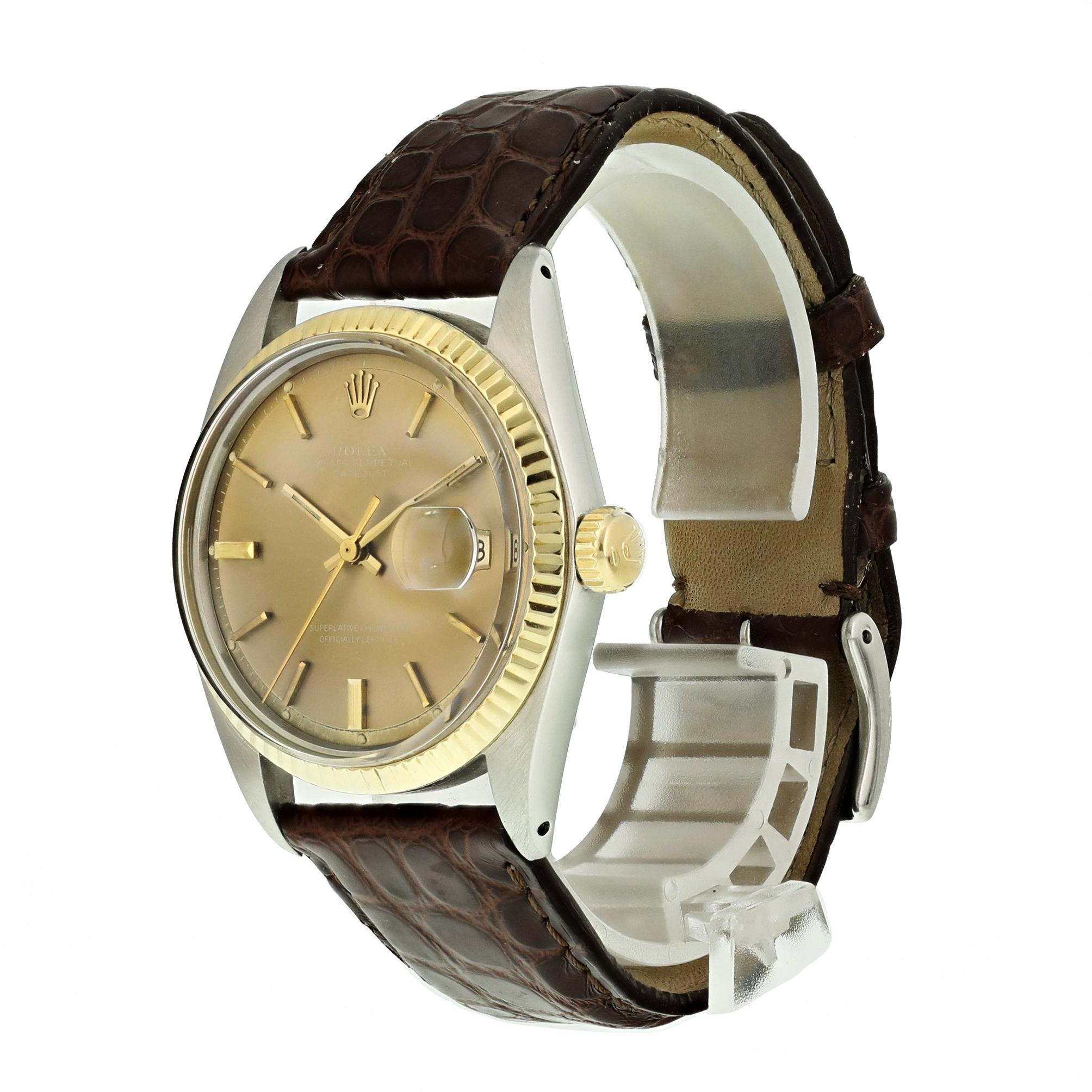 Rolex Datejust 1601 Mens Watch. 
36mm Stainless Steel case. 
Yellow Gold fluted bezel. 
Bronze dial with gold hands and index hour markers. 
Minute markers on the outer dial. 
Date display at the 3 o'clock position. 
Two Tone Stainless Steel Jubilee