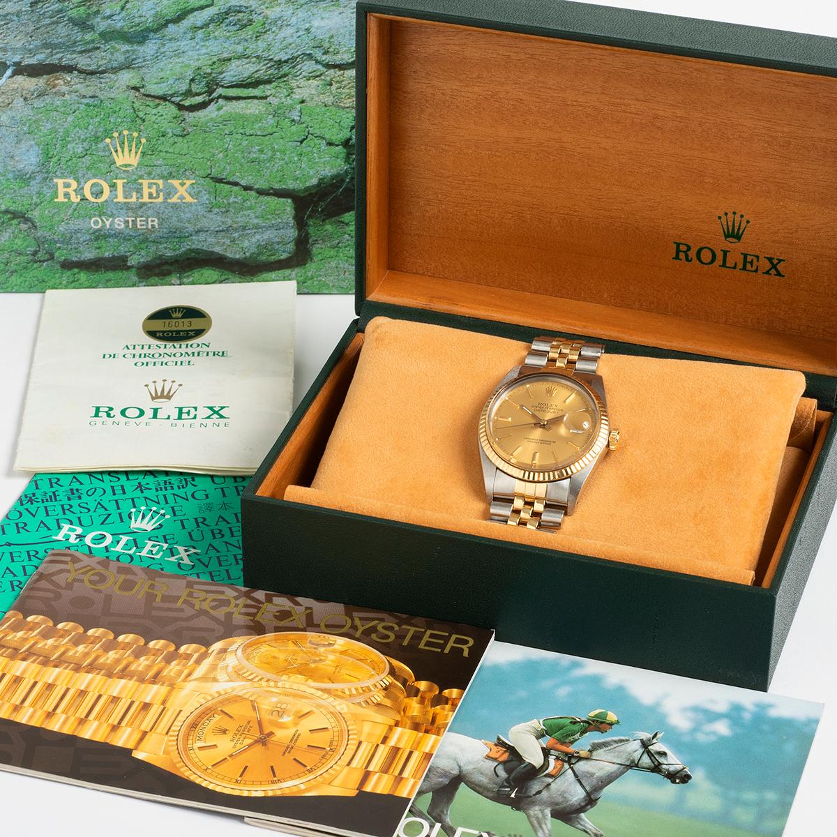 Our vintage Rolex Datejust 36mm, reference 16013, from the 1980s features the most iconic combination of stainless steel and 18k yellow gold case and jubilee bracelet with champagne baton dial. A complete set, our example comes with inner and outer