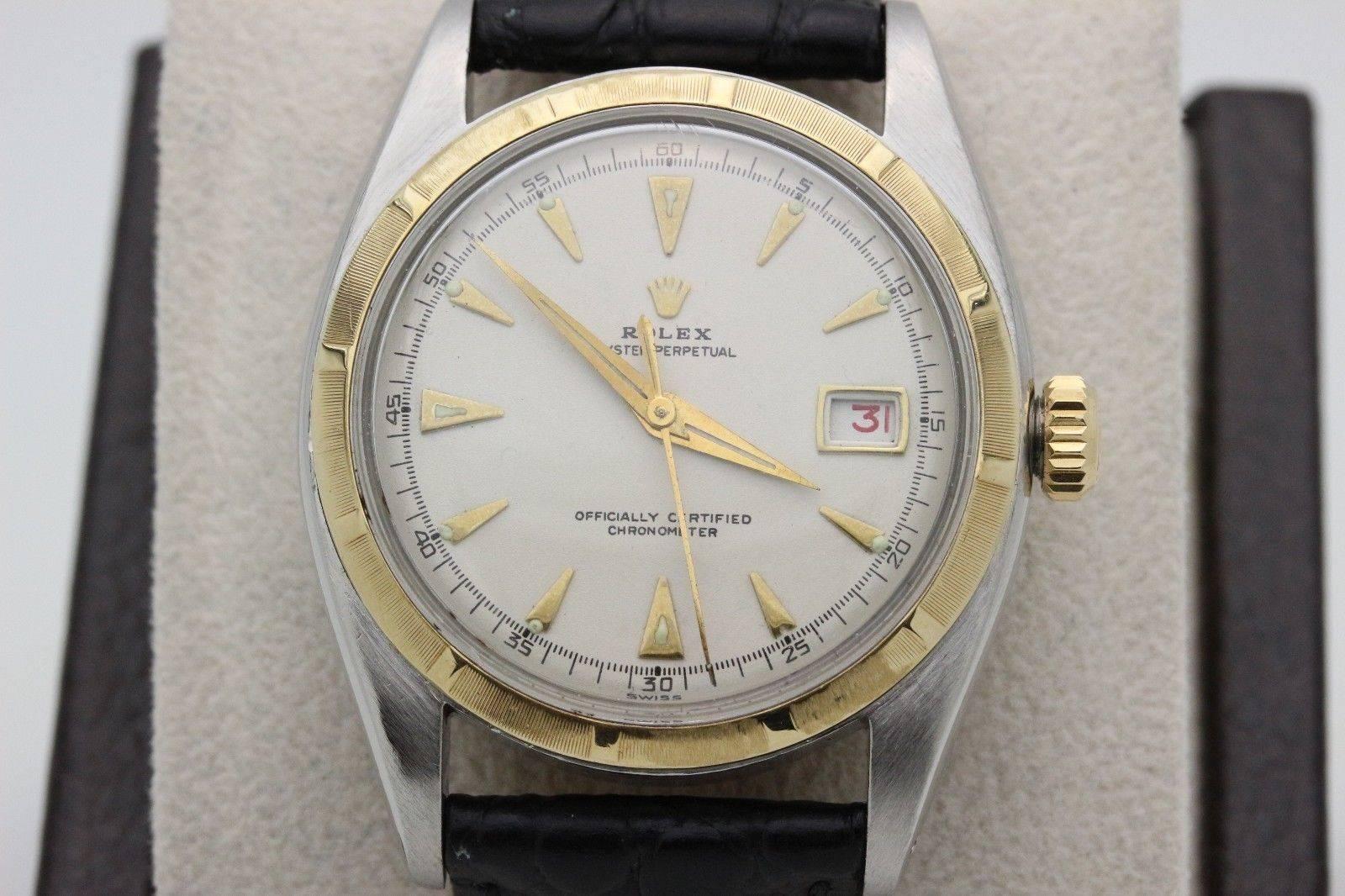 Style Number: 6105
 
Model: Datejust
 
Case: Stainless Steel
 
Band: Custom Leather Band
 
Bezel: 18K Yellow Gold
 
Dial: White
 
Face: Acrylic
 
Case Size: 36mm
 
Includes: 
-Elegant Watch Box
-Certified Appraisal 
-6 Month Warranty
 

