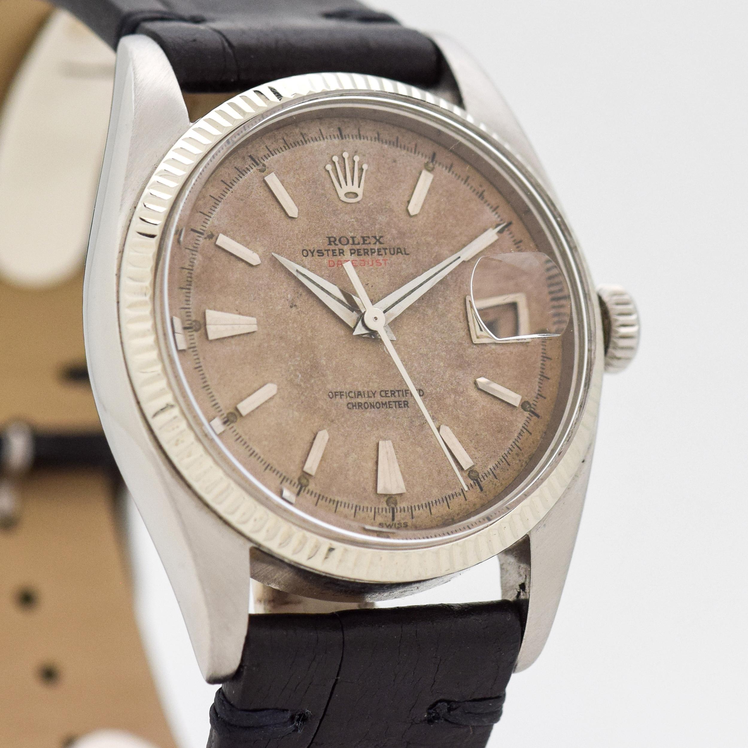 1954 Vintage Rolex Early Rare Red Datejust Ovettone Ref. 6305-1 with Alternating Red and Black Roulette Wheel Date Wheel 14k While Gold Bezel and Stainless Steel watch with Original Silver Dial with Red Datejust and Rare Applied Steel Beveled