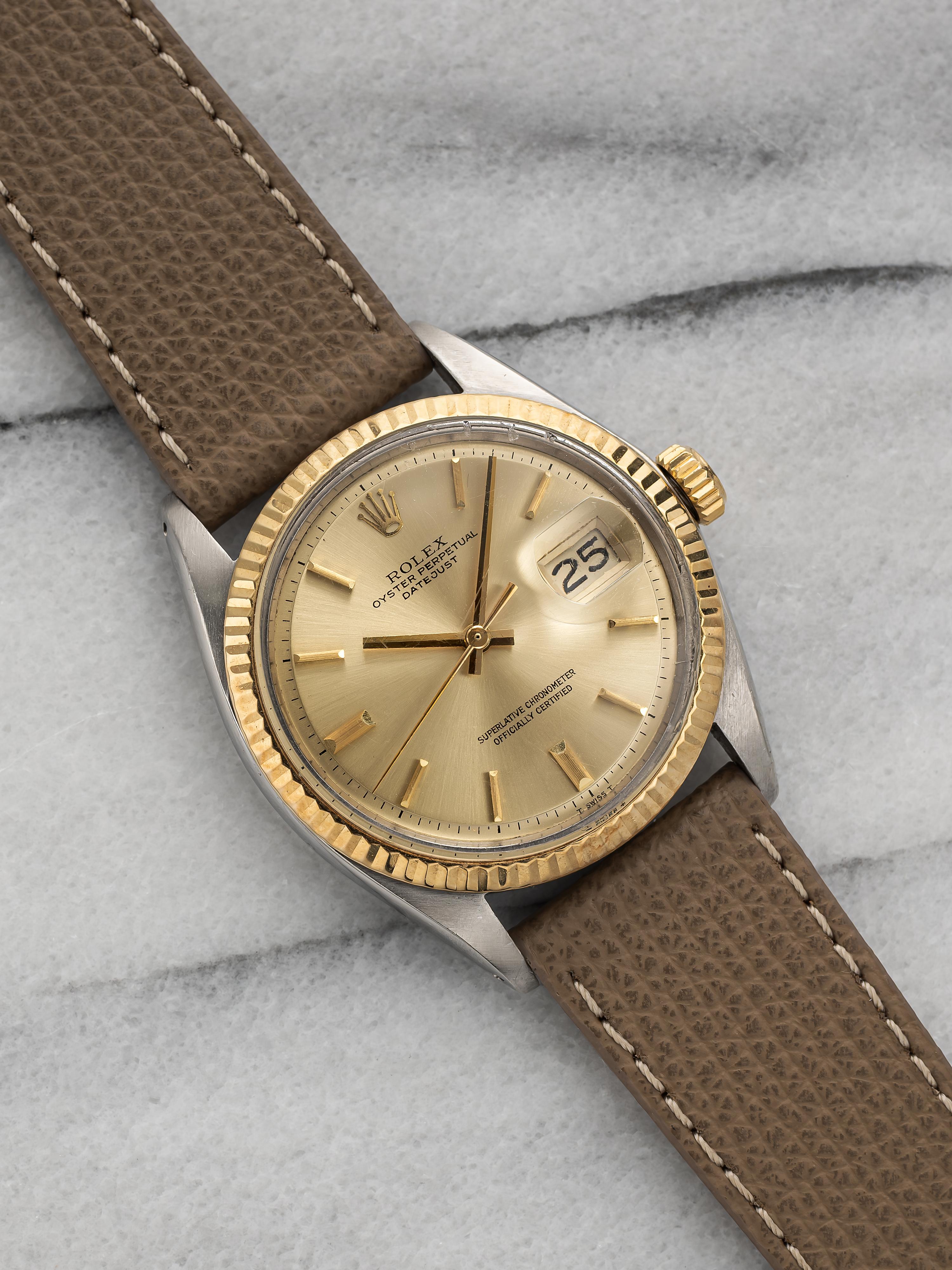 Here's a vintage Rolex Datejust reference two tone 1601 automatic with a champagne sunburst dial from the 1960s. Keeps great time and is fully functional. Measurements include a 36mm oyster case and 20mm lug width. On an aftermarket grey pebble