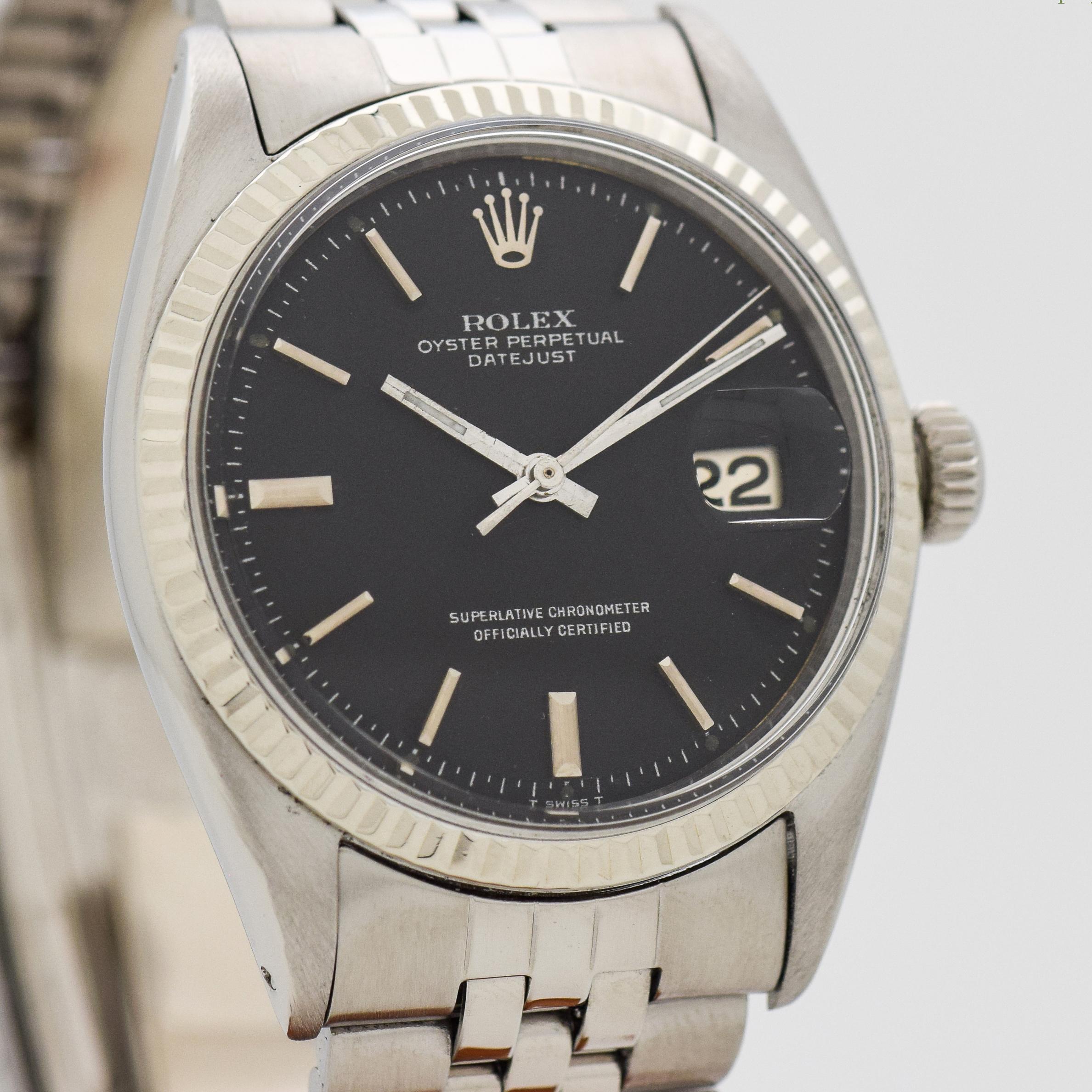 1957 Vintage Rolex Datejust Ref. 1601 14k White Gold Fluted Bezel and Stainless Steel watch with Newer Rolex Replacement Case Back with Black Dial with Applied Steel Stick/Bar/Baton Markers with Original Rolex Stainless Steel Jubilee Bracelet. 36mm