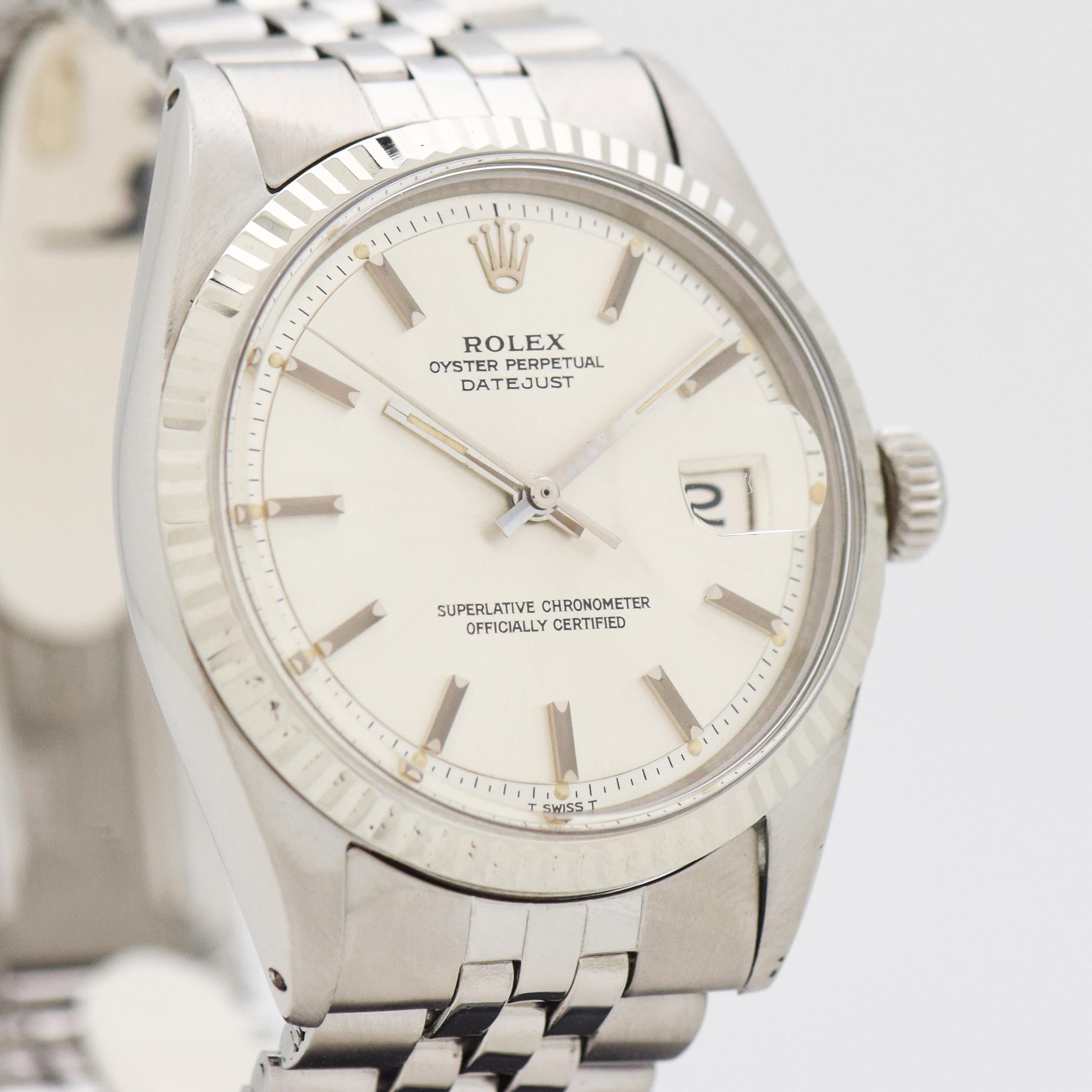 1970 Vintage Rolex Datejust Reference 1601 Watch. 14K White Gold & Stainless Steel case. Fluted bezel. Case size, 36mm wide. Silver dial with applied, silver-colored bar markers. Powered by a 26-jewel, automatic caliber movement. Equipped with an