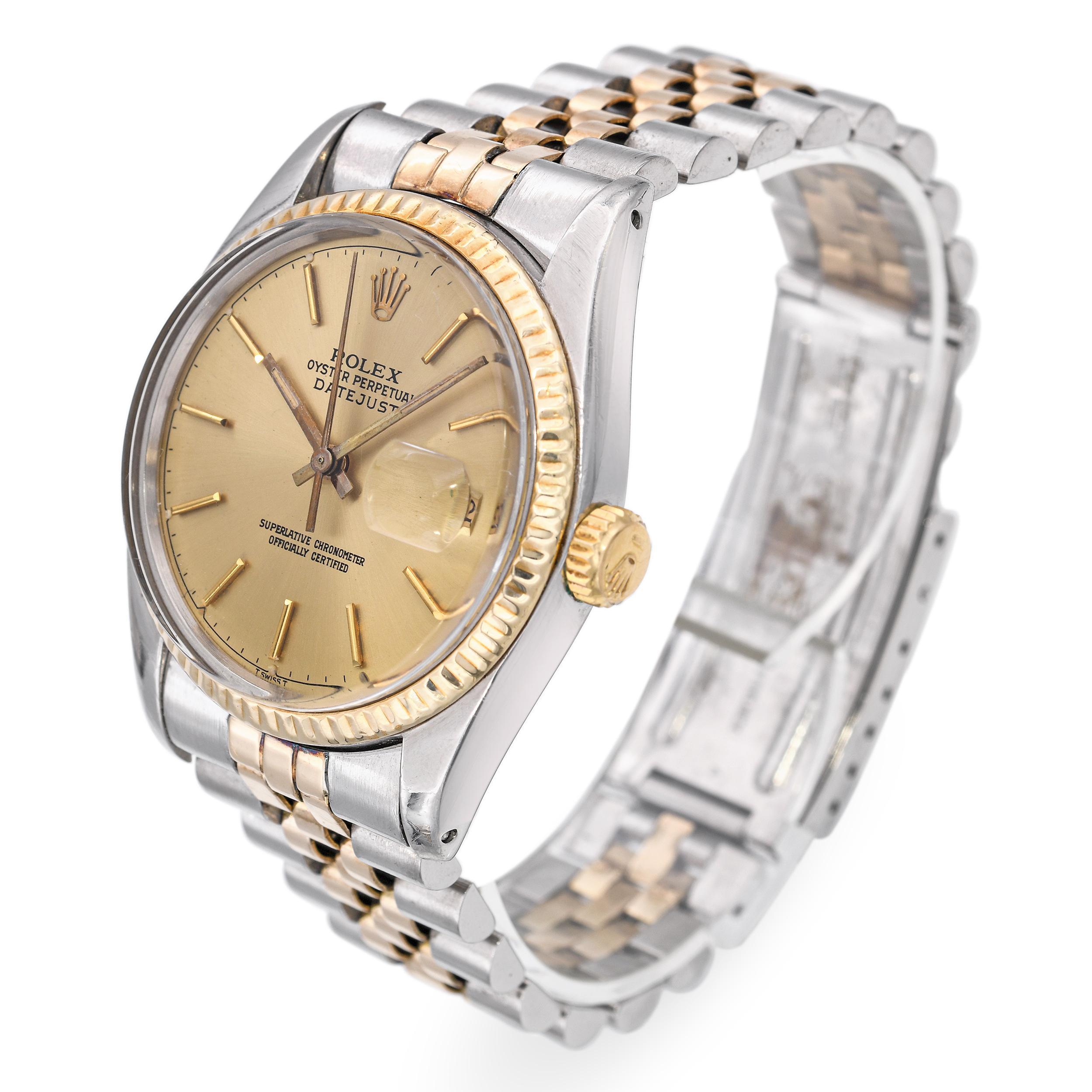 This classic vintage Rolex Oyster Perpetual Datejust is crafted in a timeless two-tone design of 14k yellow gold and stainless steel. It features the iconic day and date display on a clean, easy-to-read dial. The watch is fitted with a Jubilee