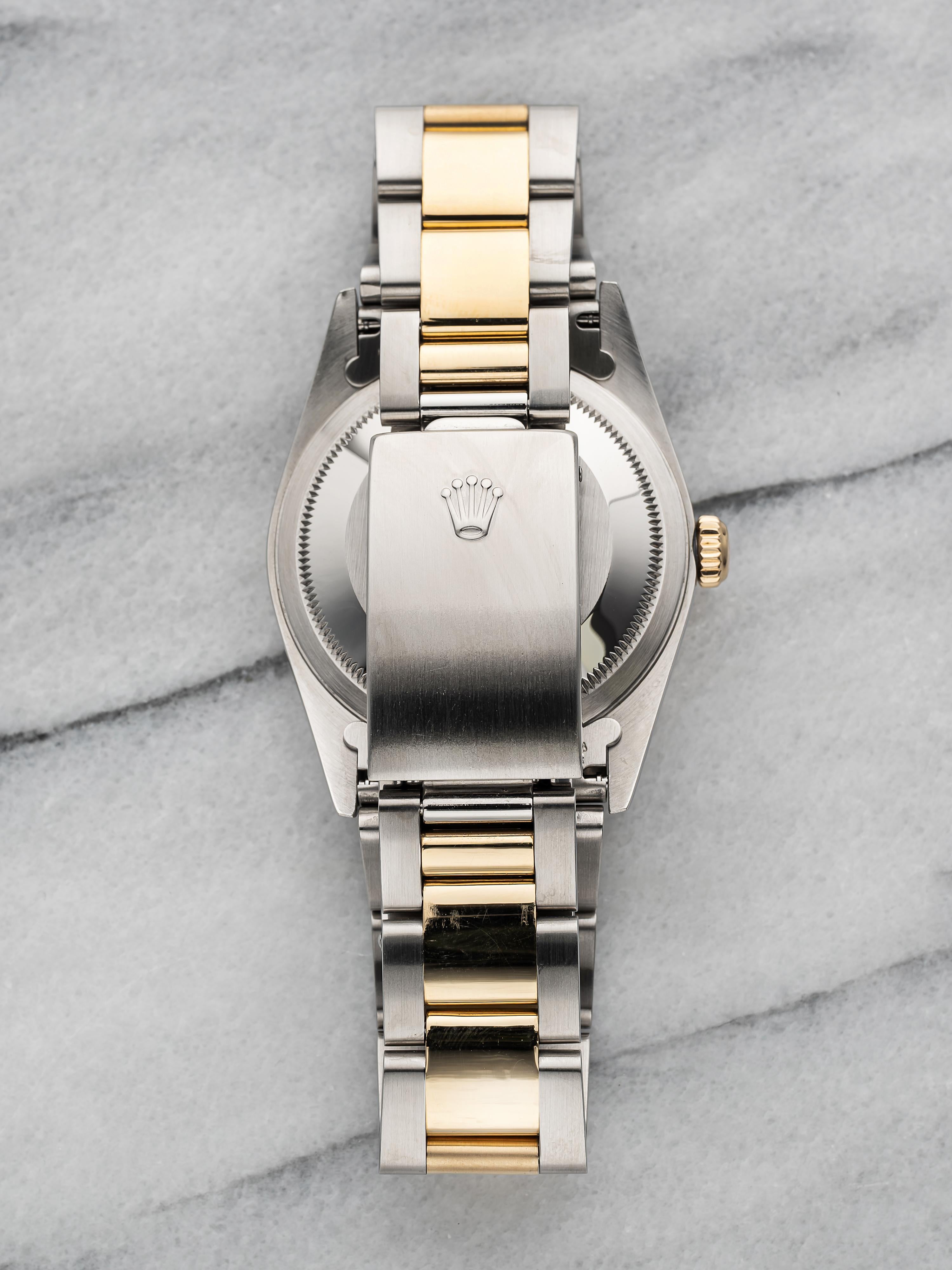 Here's a vintage Datejust two tone reference 16023 with an original onyx diamond dial from the early 2000s. Comes with its original box and papers. Keeps great time and is fully functional. Measurements include a 36mm oyster case and 20mm lug width.