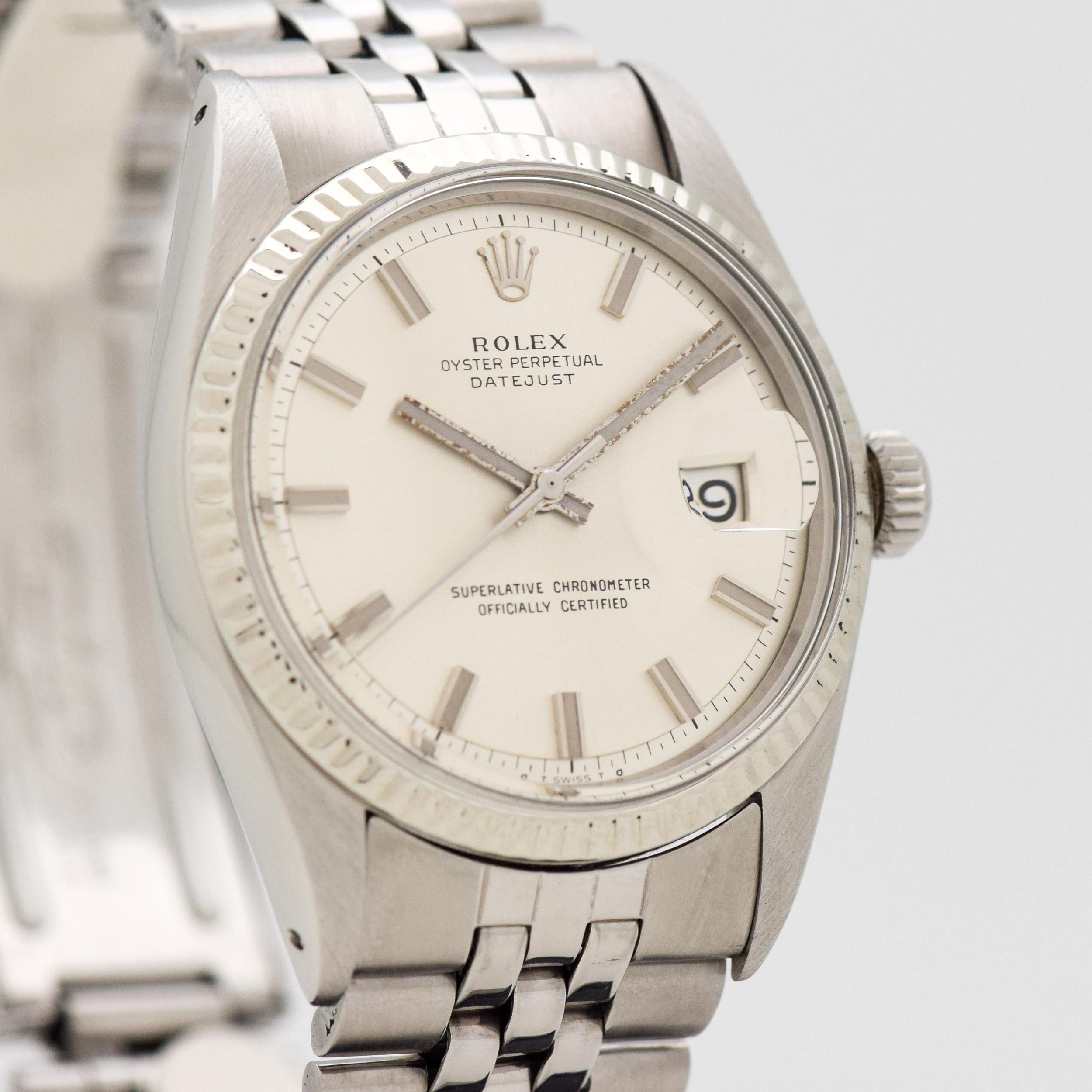 a 1972 Vintage Rolex Datejust Reference 1601. 14K White Gold & Stainless Steel case. Fluted bezel. 36mm wide. Wide Boy Markers & Hands. Powered by a 26-jewel, automatic caliber movement. Featured on an original, Rolex Stainless Steel Jubilee