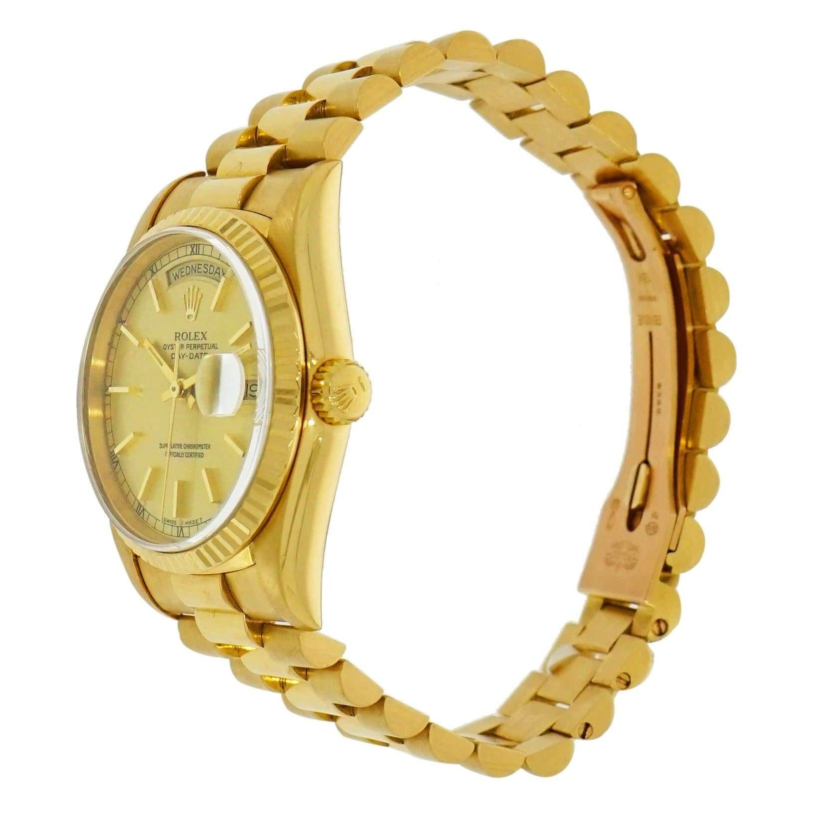Excellent condition pre-owned Vintage Rolex Day-Date, 36mm case, certified Chronometer automatic self-winding movement, Champagne dial with yellow gold index markers, date at 3 o’clock, sapphire crystal on 18 Karat Yellow Gold bracelet. This watch