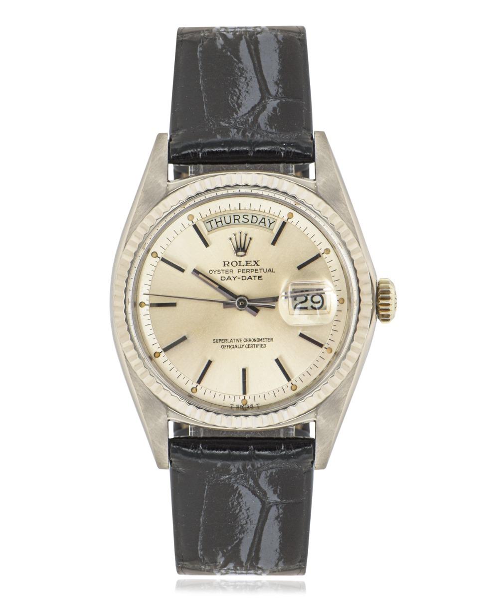 A vintage 18k white gold 36mm Day-Date men's wristwatch, by Rolex.

The time is elegantly displayed on a rare silver pie-pan dial with iconic day and date aperture, hours indicated with applied hour markers and displays the minutes around the outer