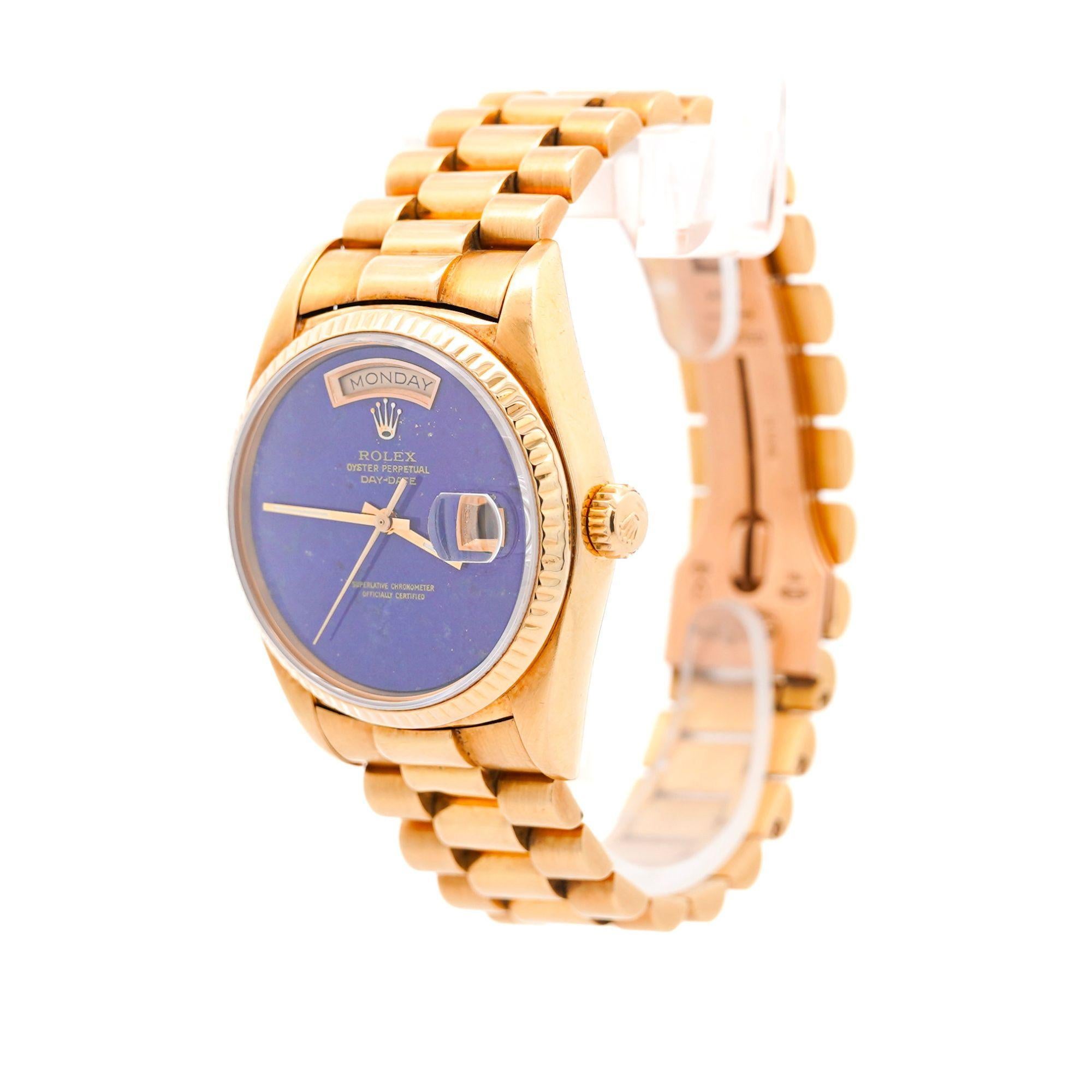 Rare Vintage Rolex 36mm Day-Date Blue Lapis Lazuli Ref. 18038 in 18K Yellow Gold with Fluted Bezel. Includes a vintage Rolex box, not original to this watch.

Details:
Brand: Rolex
Model: Day-Date
Reference Number: 18038
Metal: 18K Yellow