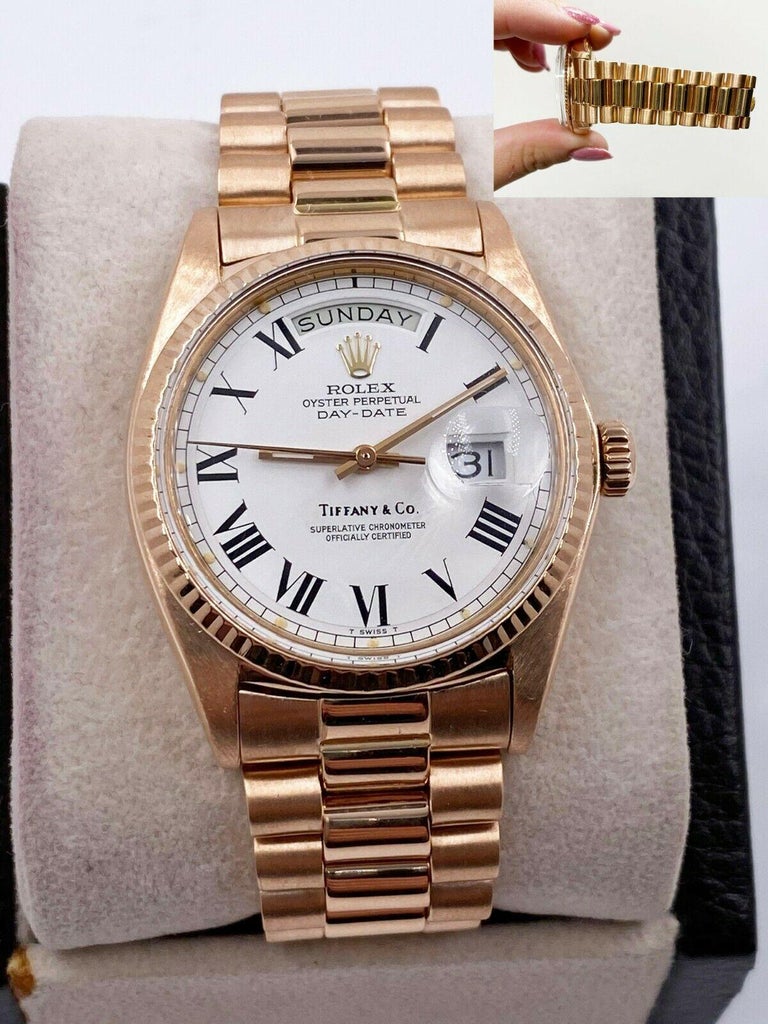 Style Number: 1803

 

Serial: 3991***

 

Model: Day Date President 

 

Case Material: 18K Rose Gold 

 

Band: 18K Rose Gold 

 

Bezel: 18K Rose Gold 

 

Dial: Original Factory White Tiffany & Co. 

 

Face: Acrylic 

 

Case Size: 36mm

