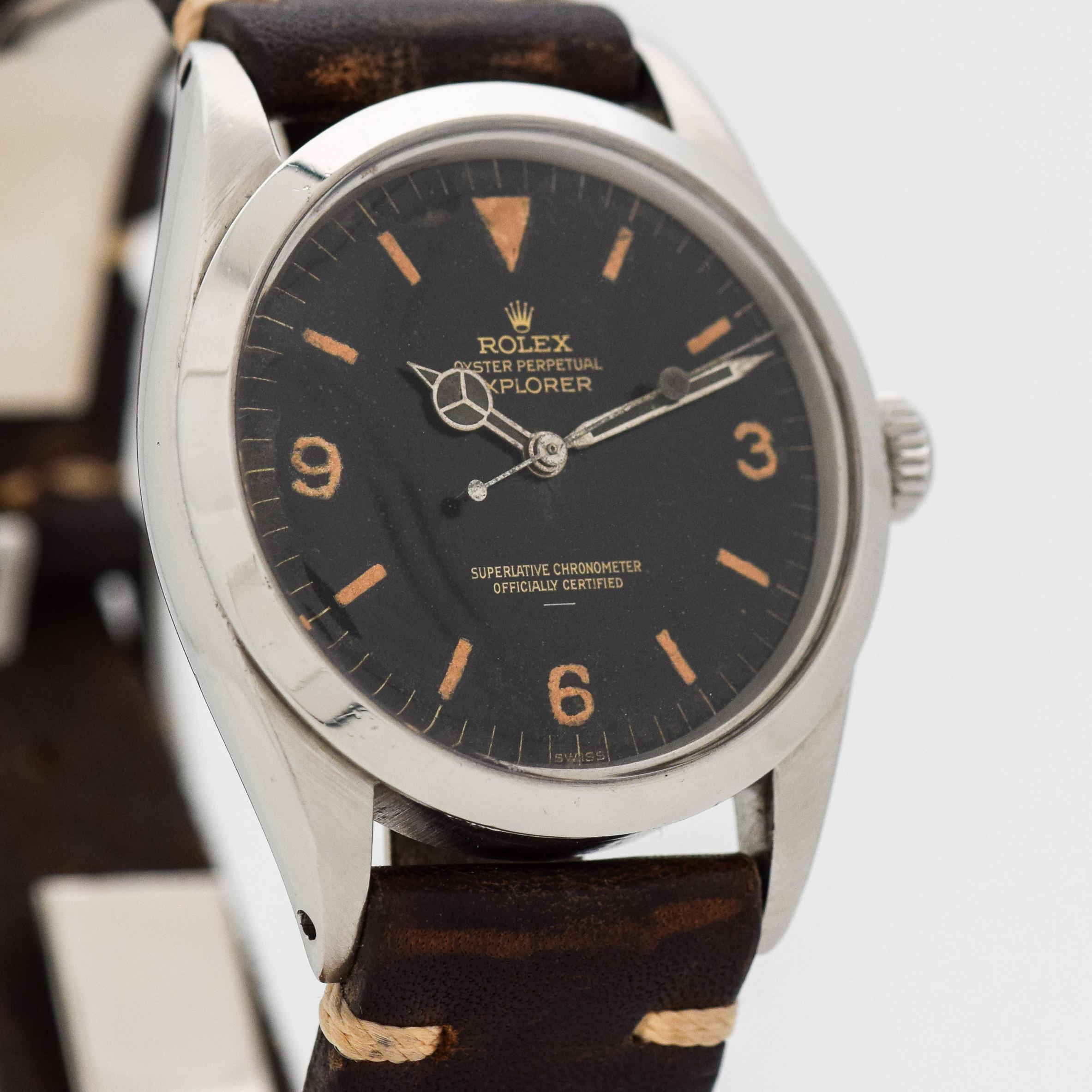 1964 Vintage Rolex Explorer Highly Collectible and Desirable Early (2nd Year) Ref. 1016 Stainless Steel watch with Original Gilt And Underlined Patina Black Dial with Luminous Arabic 3, 6, and 9 with Genuine Steel Rolex Buckle. 36mm x 43mm lug to