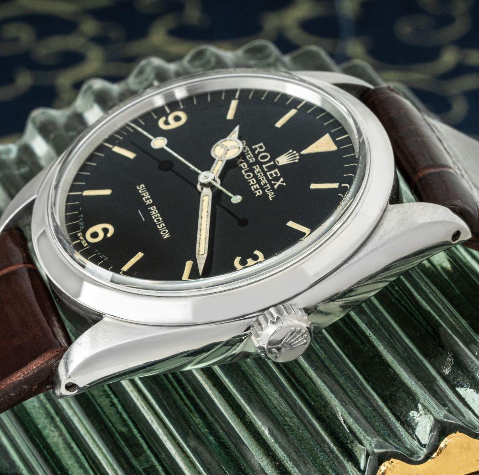 A vintage Rolex Explorer in stainless steel. Featuring a black gilt dial with arabic numbers, a distinctive 'super precision' underlined at 6 o'clock and a steel bezel. The watch is fitted with a plastic glass, a self-winding automatic movement and
