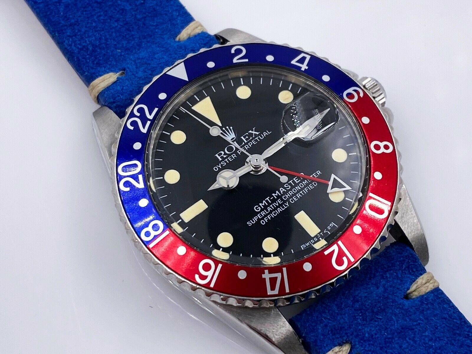 Style Number: 1675

 

Serial: 623***


Year: 1960

 

Model: GMT Master

 

Case Material: Stainless Steel

 

Band: Custom Blue Suede Leather Band 

 

Bezel:  Pepsi- Red and Blue 

 

Dial: Black 

 

Face: Acrylic 

 

Case Size: 40mm

