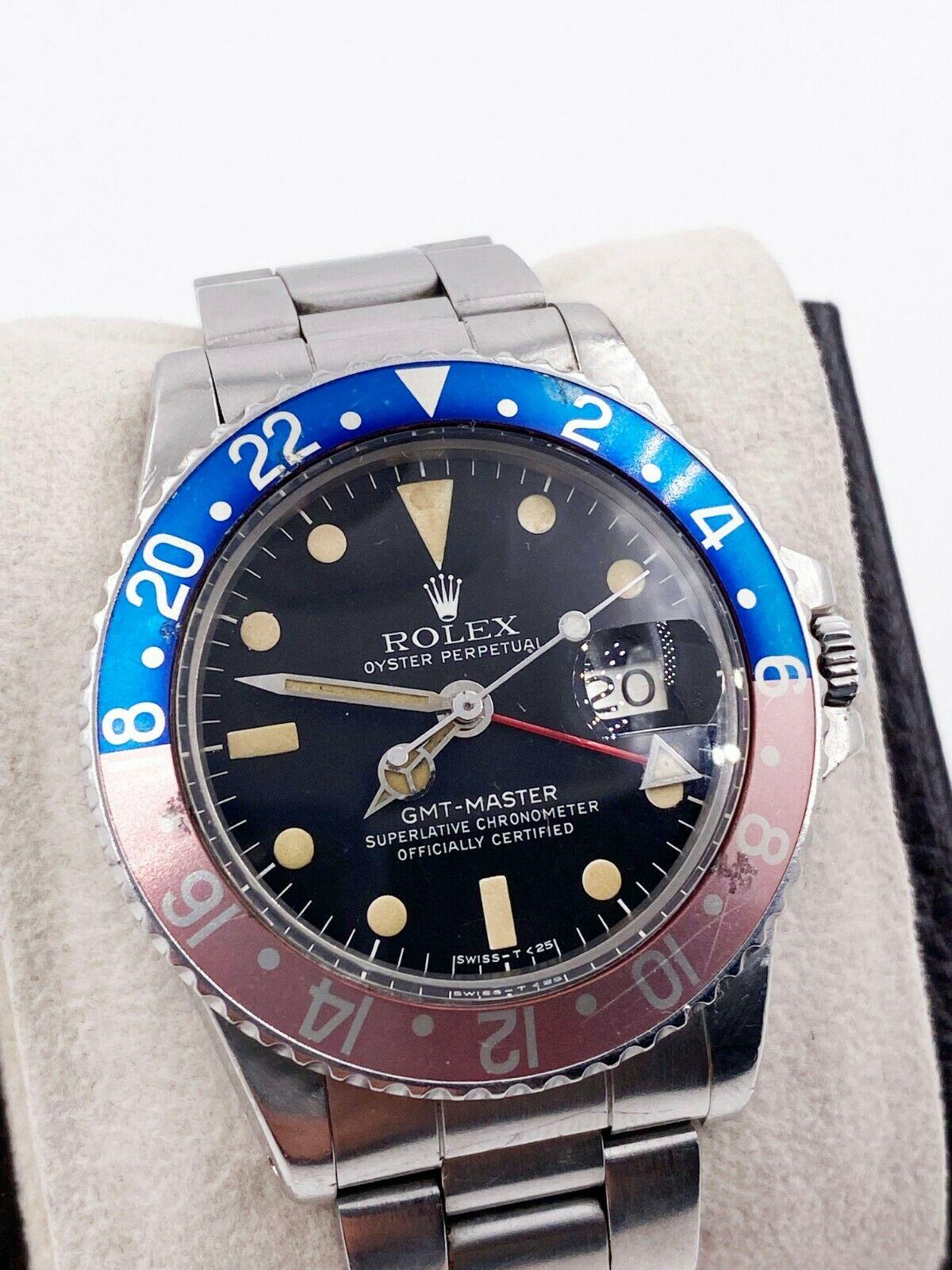 Style Number: 1675

 

Serial: 5467***


Year: 1978

 

Model: GMT Master 

 

Case Material: Stainless Steel

 

Band: Stainless Steel (Newer Style Band) 

 

Bezel:  Pepsi - Red and Blue 

 

Dial: Matte Black Dial 

 

Face: Acrylic 

 

Case