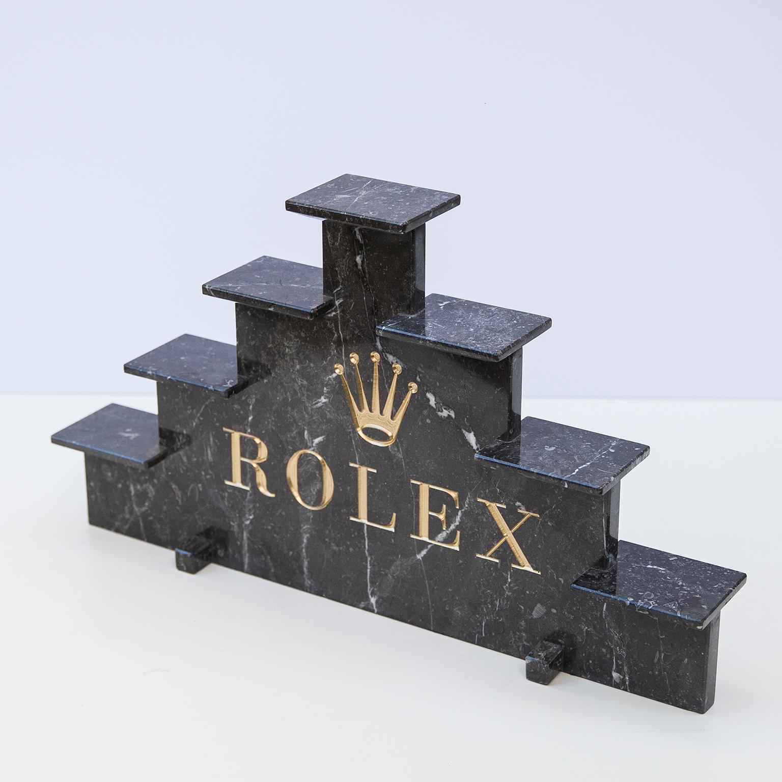 Marble watch display marked with golden letters by Rolex, 1970s.